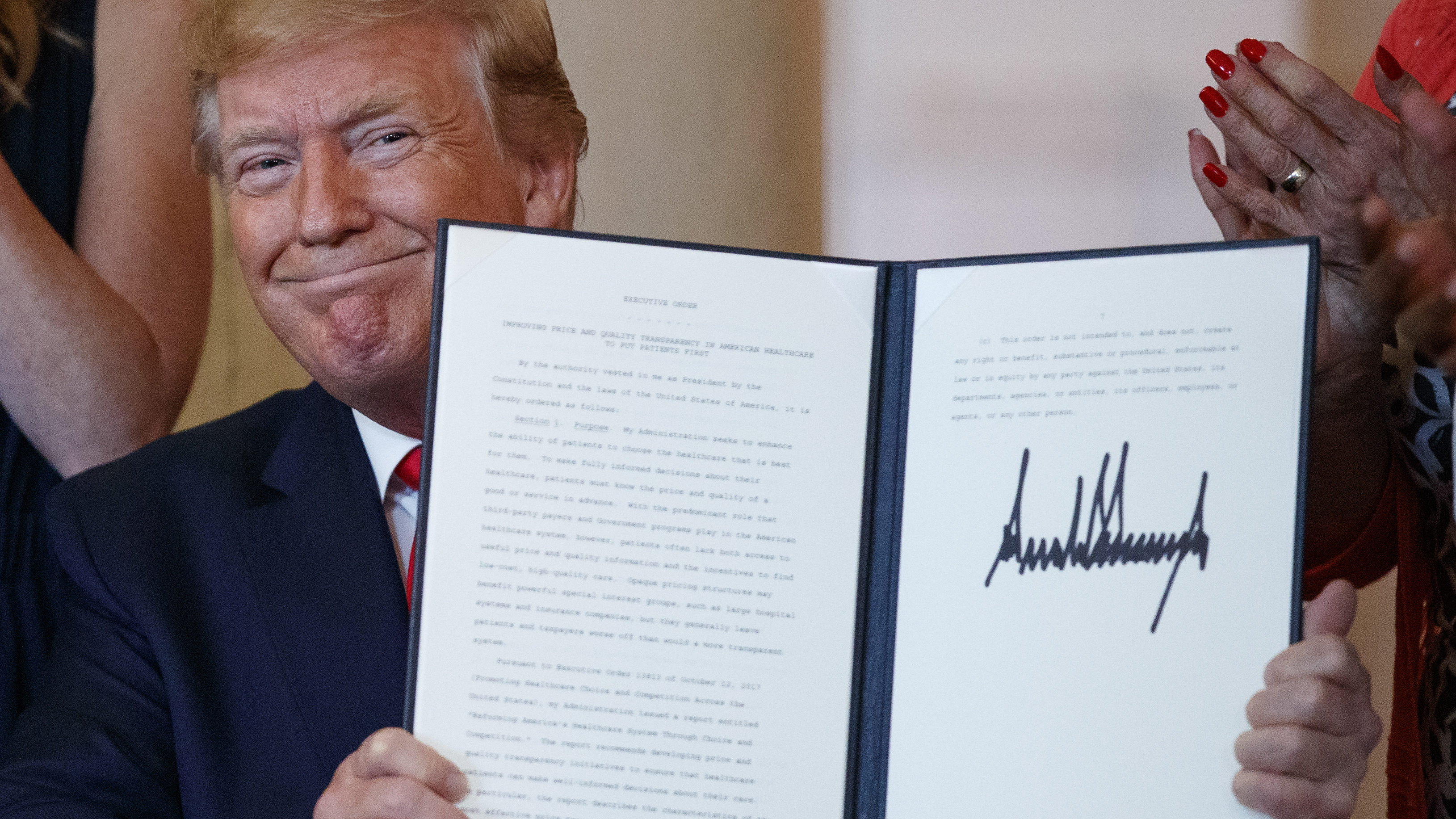 The executive order on drug price transparency that President Trump signed Monday doesn't spell out specific actions; rather, it directs the department of Health and Human Services to develop a policy and then undertake a lengthy rule-making process.