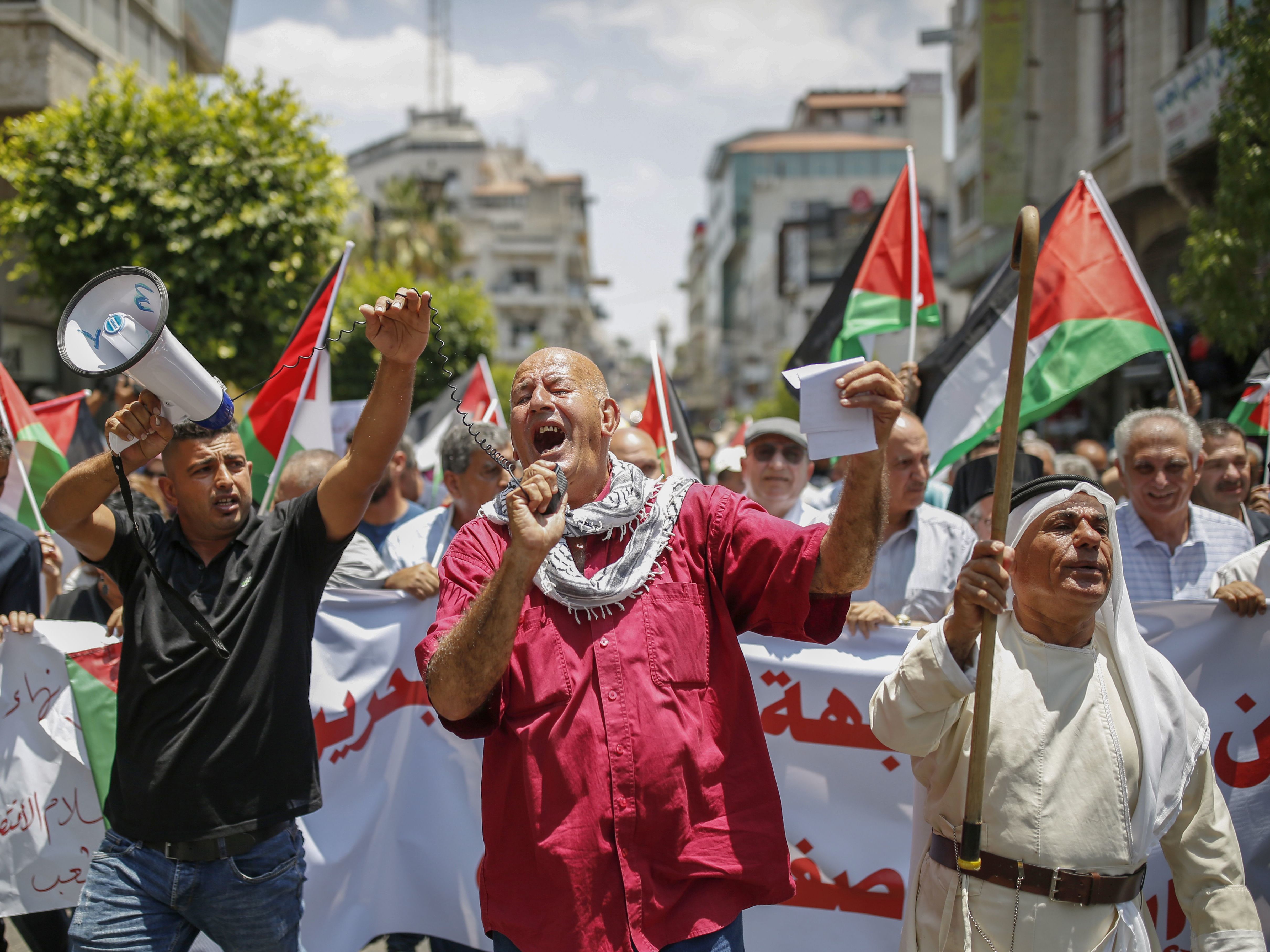 Palestinians in the occupied West Bank town of Ramallah protest the Trump administration's new peace plan on June 15. (AFP/Getty Images)
