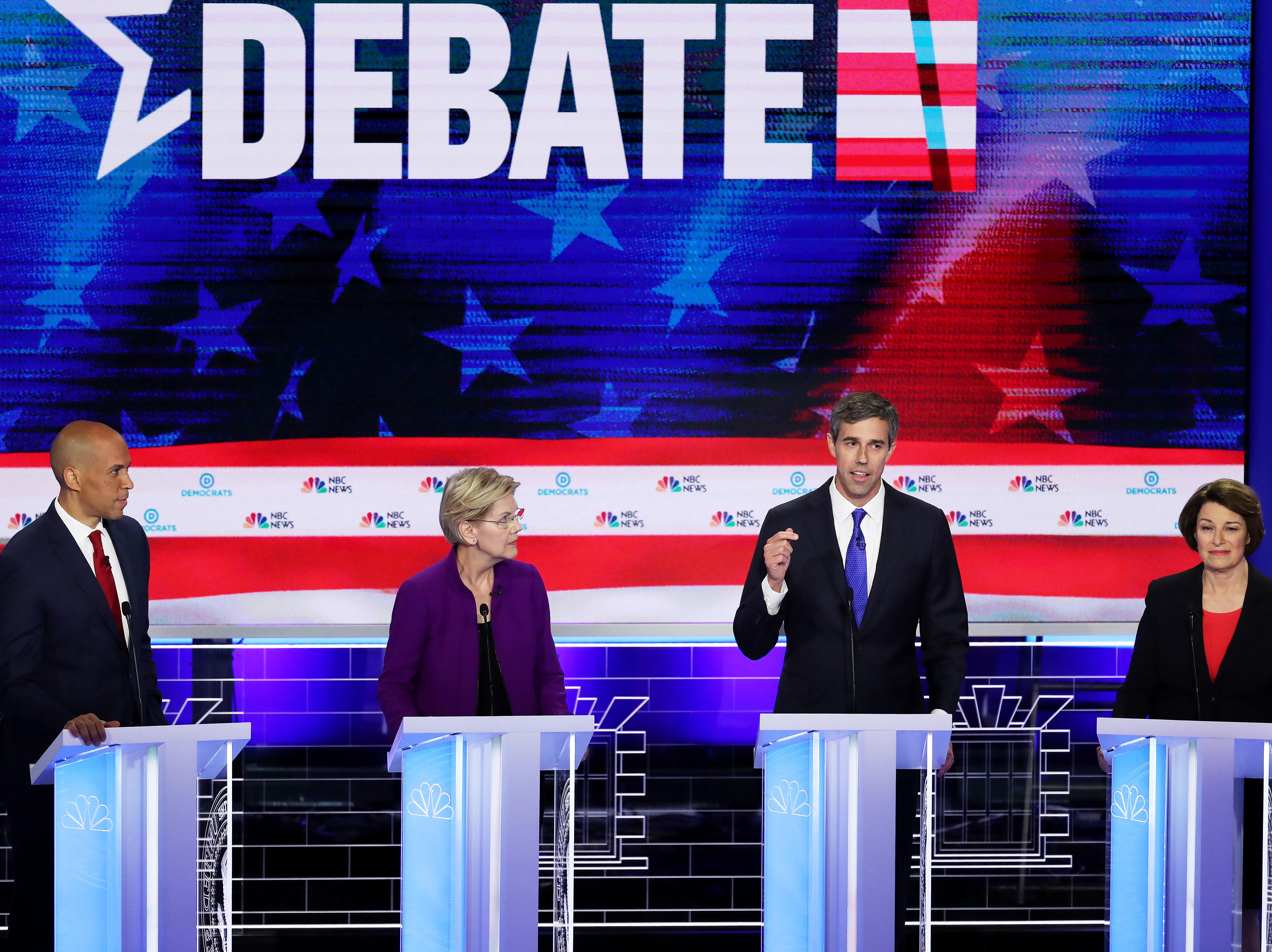 Former Texas Rep. Beto O'Rourke (third from left) speaks as Sens. Cory Booker, Elizabeth Warren and Amy Klobuchar look on during the first night of the Democratic presidential debate, Wednesday in Miami. (Getty Images)
