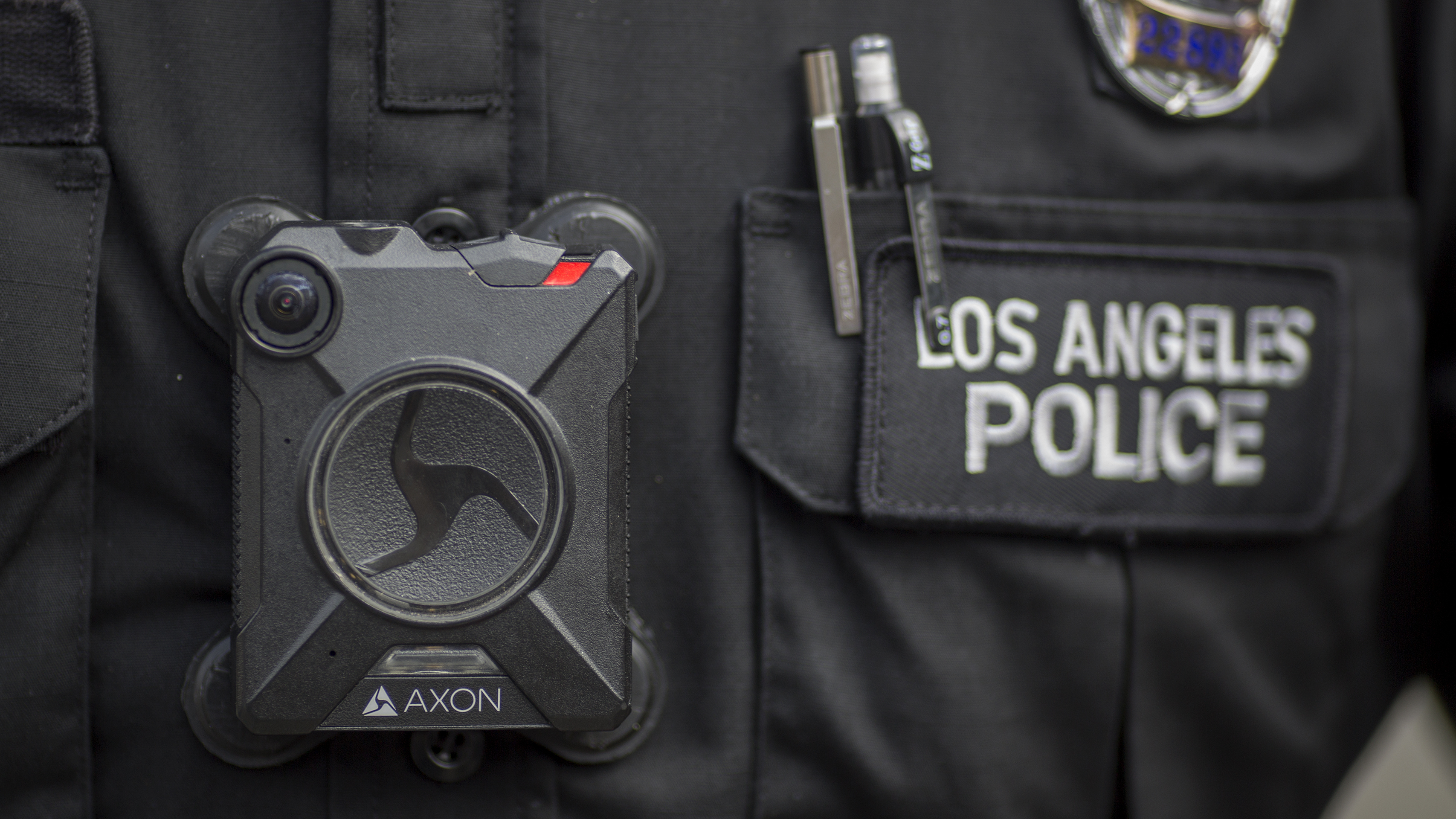 A Los Angeles police officer wears an Axon body camera in 2017. On Thursday, the company announced it is holding off on facial recognition software, citing its unreliability. (Getty Images)