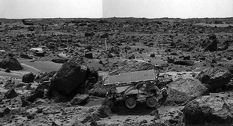 The Sojourner rover's Alpha Proton X-ray Spectrometer (APXS) is shown deployed against the rock "Moe" on Sol 64.