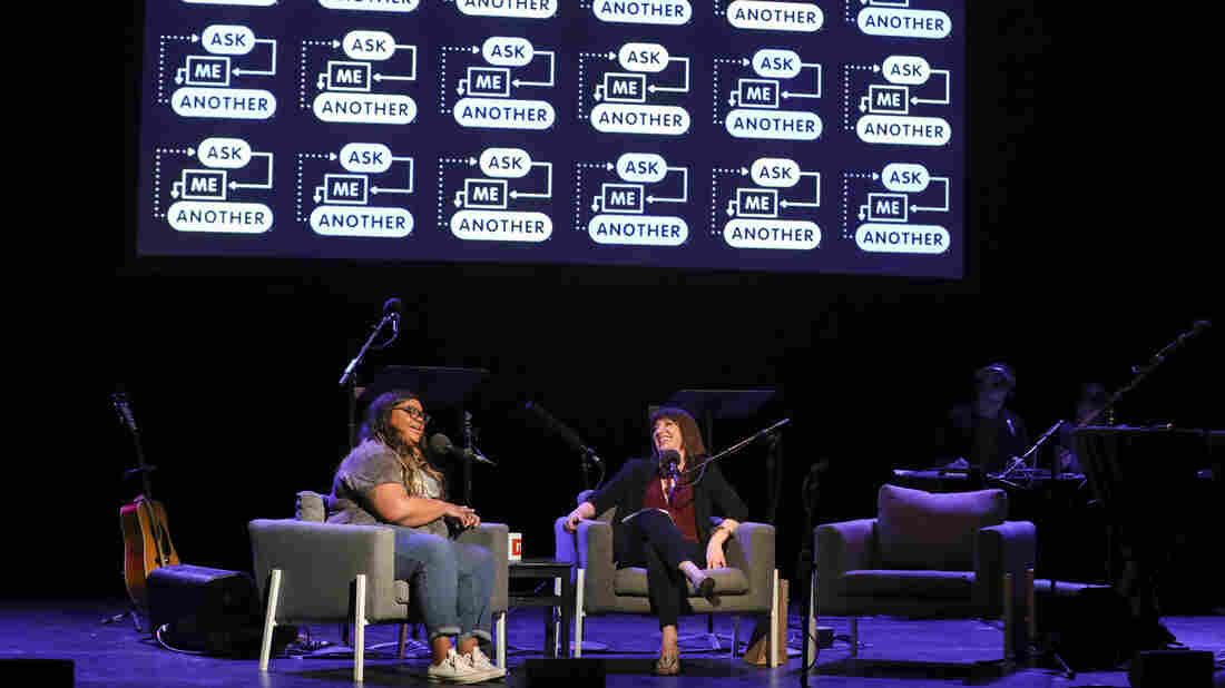 Nicole Byer chats with Ask Me Another host Ophira Eisenberg at the Moore Theatre, in Seattle, Washington.