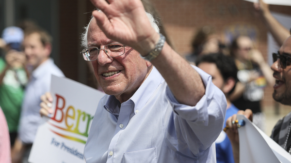Democratic presidential candidate Sen. Bernie Sanders, I-Vt., waves as he marches with supporters in the Nashua Pride Parade in Nashua, N.H. on June 29, 2019.