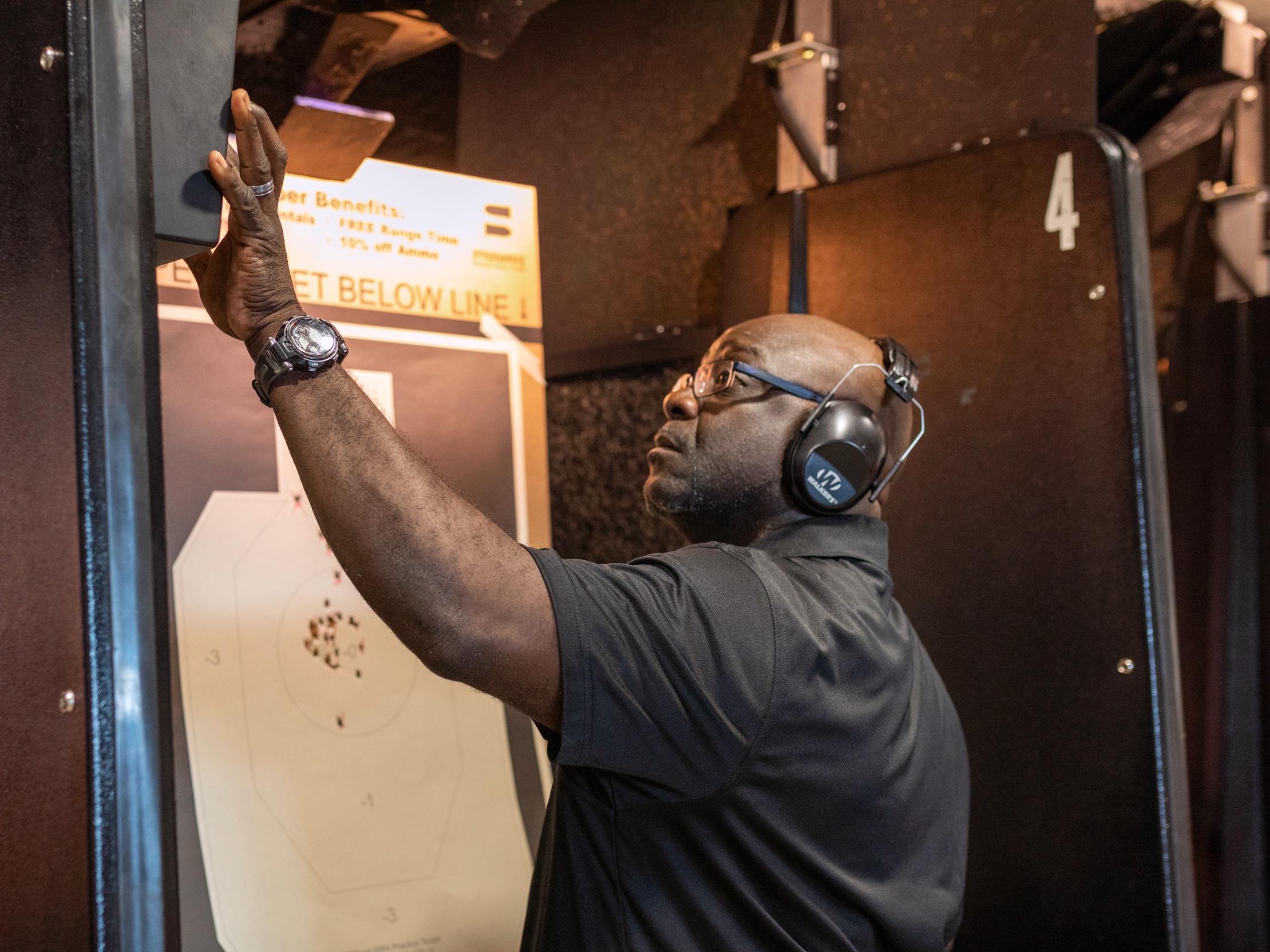 Colin Mapp examines his target in the gun range. About 24% of African Americans said they own guns according to 2017 study by Pew Research Center.