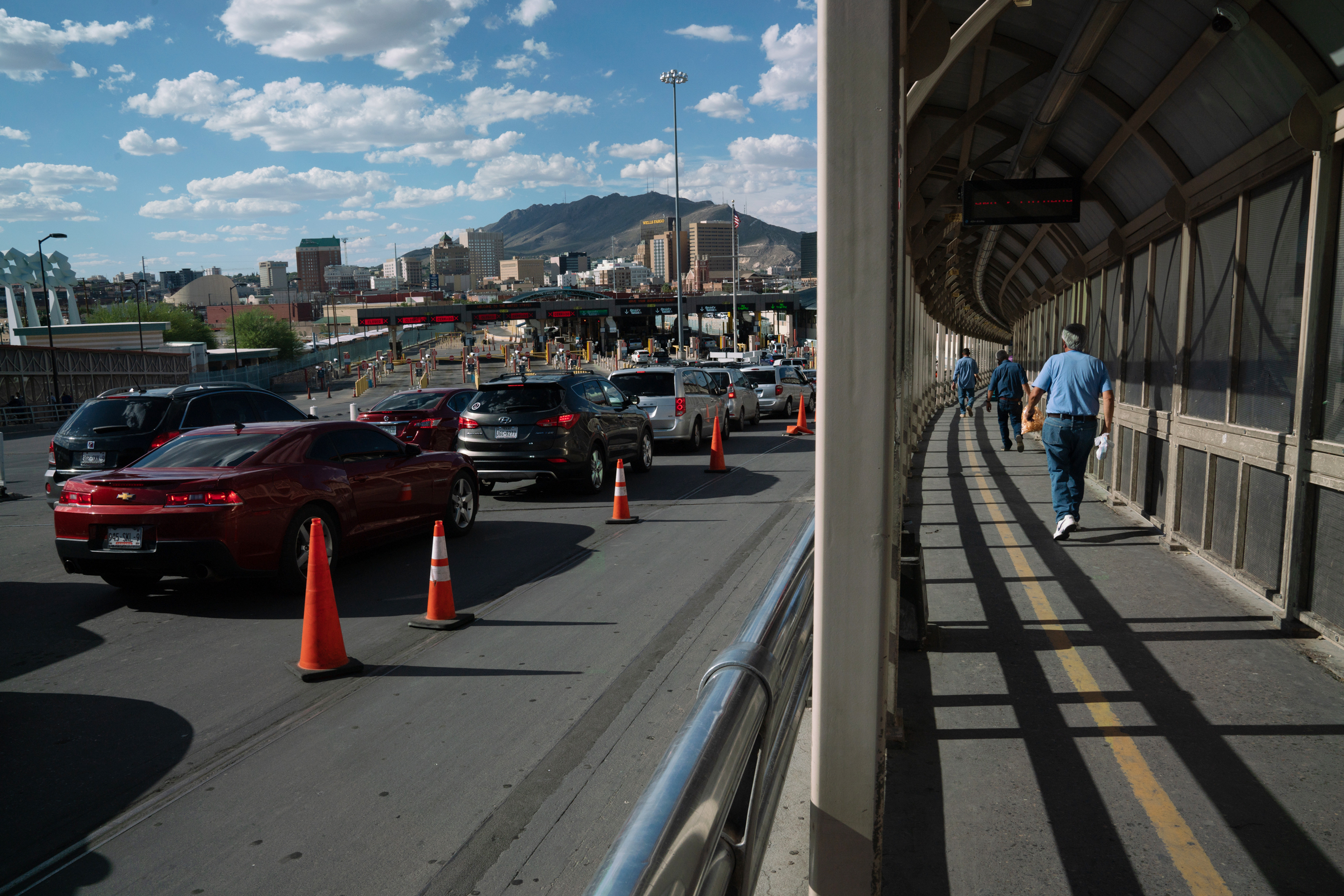 Cars and pedestrians cross the Paso del Norte International Bridge, which runs between Juárez, Mexico, and El Paso, Texas, on Tuesday. (NPR)
