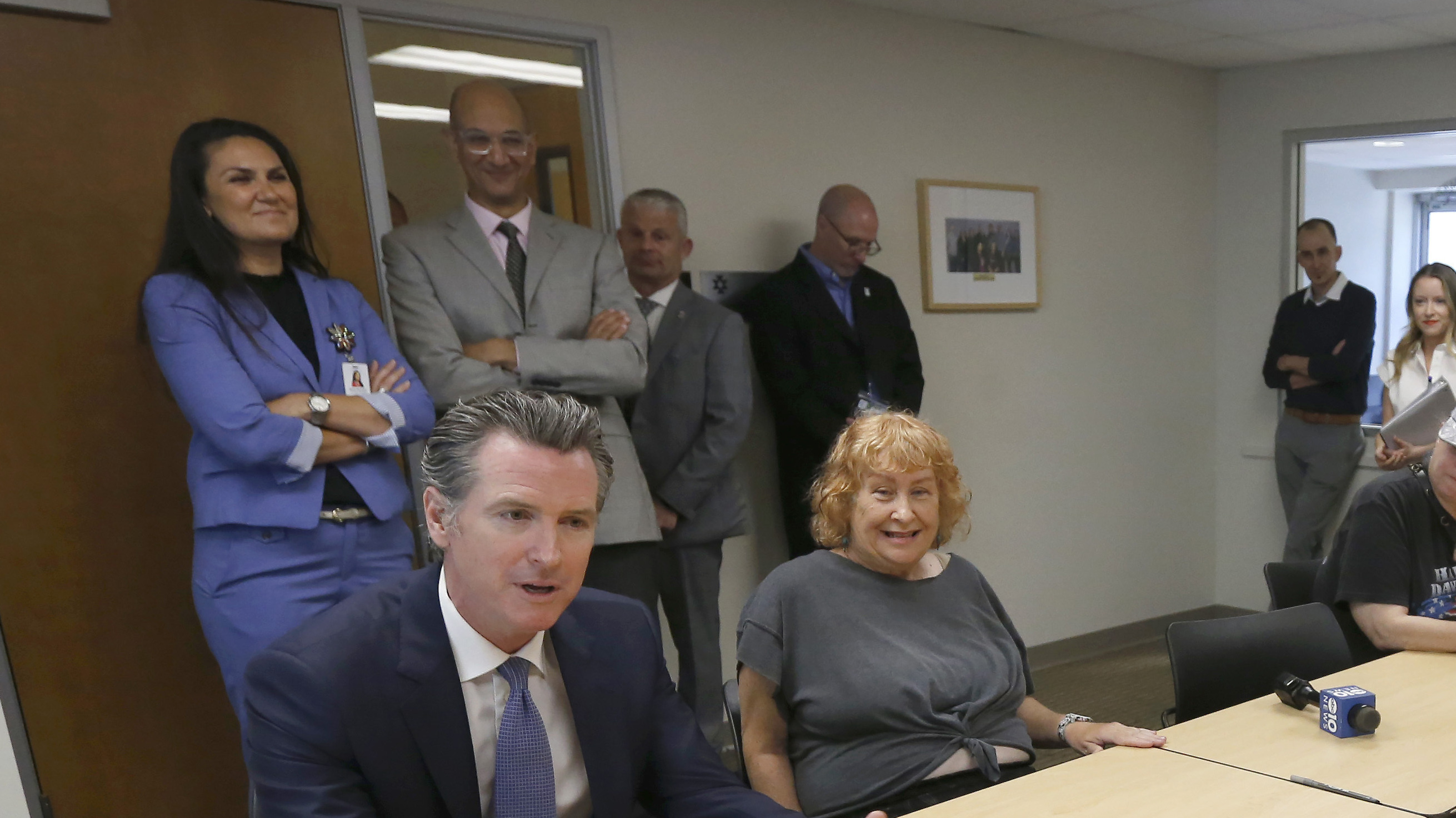 Gov. Gavin Newsom, left, talks with members of a Diabetes Talking Circle during his visit to the Sacramento Native American Health Center in Sacramento Tuesday.