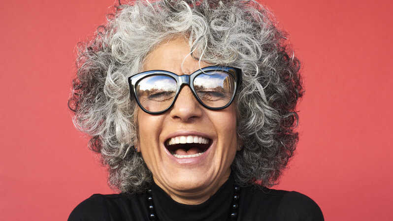 A woman laughing.