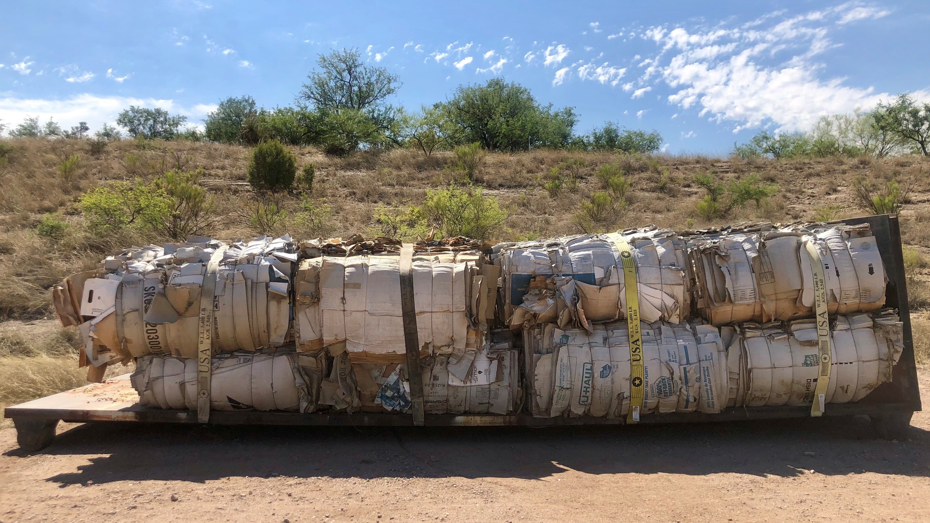 Cardboard boxes waiting for a buyer to recycle them in Nogales, Arizona. If they're not bought, the boxes will most likely head to a landfill. (Sarah Gonzalez)