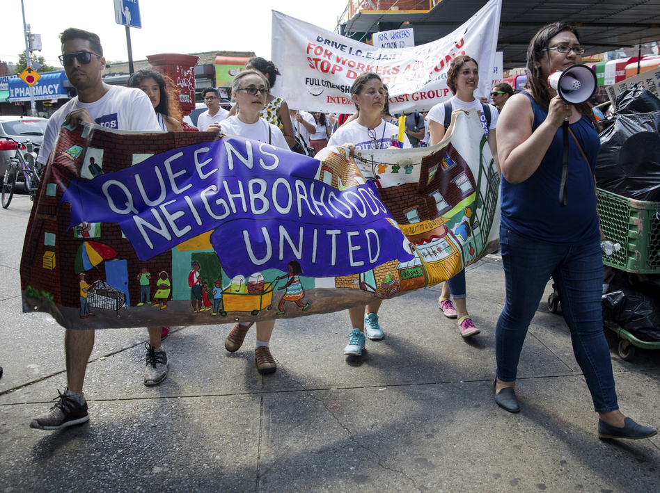 In New York City, hundreds of people march in Queens on Sunday in opposition to the Trump administration's plans to continue with raids to catch immigrants in the country illegally. (Julius Constantine Motal/AP)