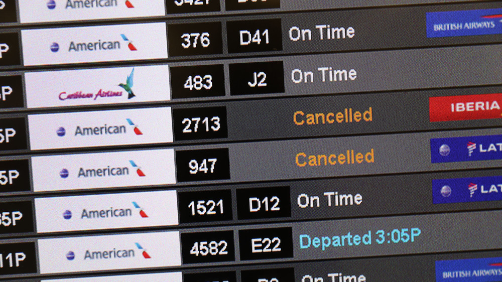 A sign at the Miami International Airport shows cancelled flights after American Airlines initially grounded its Boeing 737 Max  planes in March. (Getty Images)