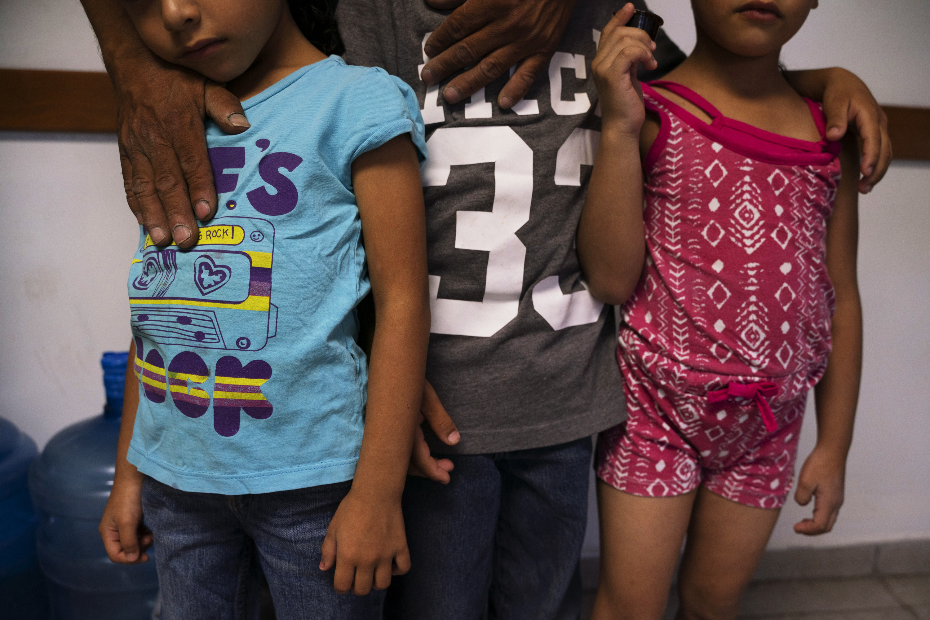 Giovani, with his son Jonathan (center), and twin daughters Catherine and Carla at a shelter in Ciudad Juárez. Giovani says that care has been hard for the family to get in Juárez. (Paul Ratje for NPR)