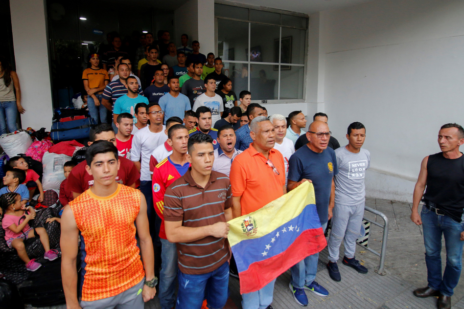 Venezuelan soldiers and policemen who deserted to Colombia protest after being evicted from the hotel where they were staying in Cúcuta in May. More than 1,400 members of Venezuelan security forces fled the country in February and March. (Schneyder Mendoza/AFP/Getty Images)