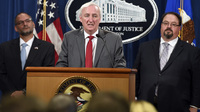 From left, Hugh Hurwitz, acting director of the Bureau of Prisons; Deputy Attorney General Jeffrey Rosen; and David Muhlhausen, director of the National Institute of Justice, appear at a press conference at the Department of Justice on Friday.