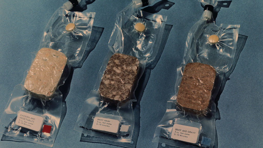 Some of the space food that was scheduled to be carried on the Apollo 11 lunar landing mission included (from left to right): chicken and vegetables, beef hash, and beef and gravy.