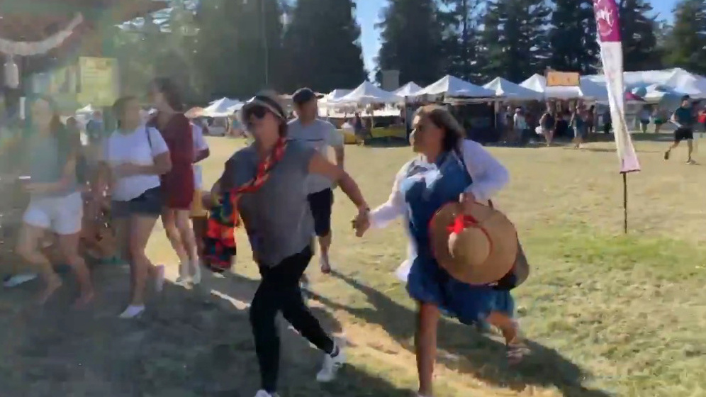 People run for safety after a gunman opened fire at the Gilroy Garlic Festival, south of San Jose, Calif., on Sunday. (via Reuters)