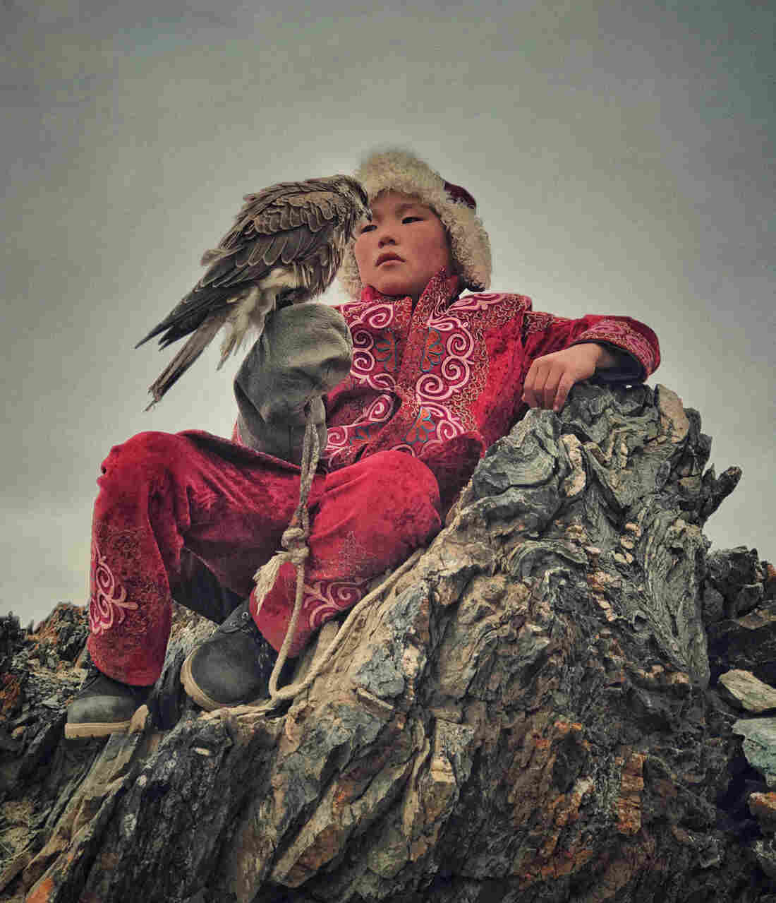 A boy with his hunting bird in Bayan Ulgi province, Mongolia.