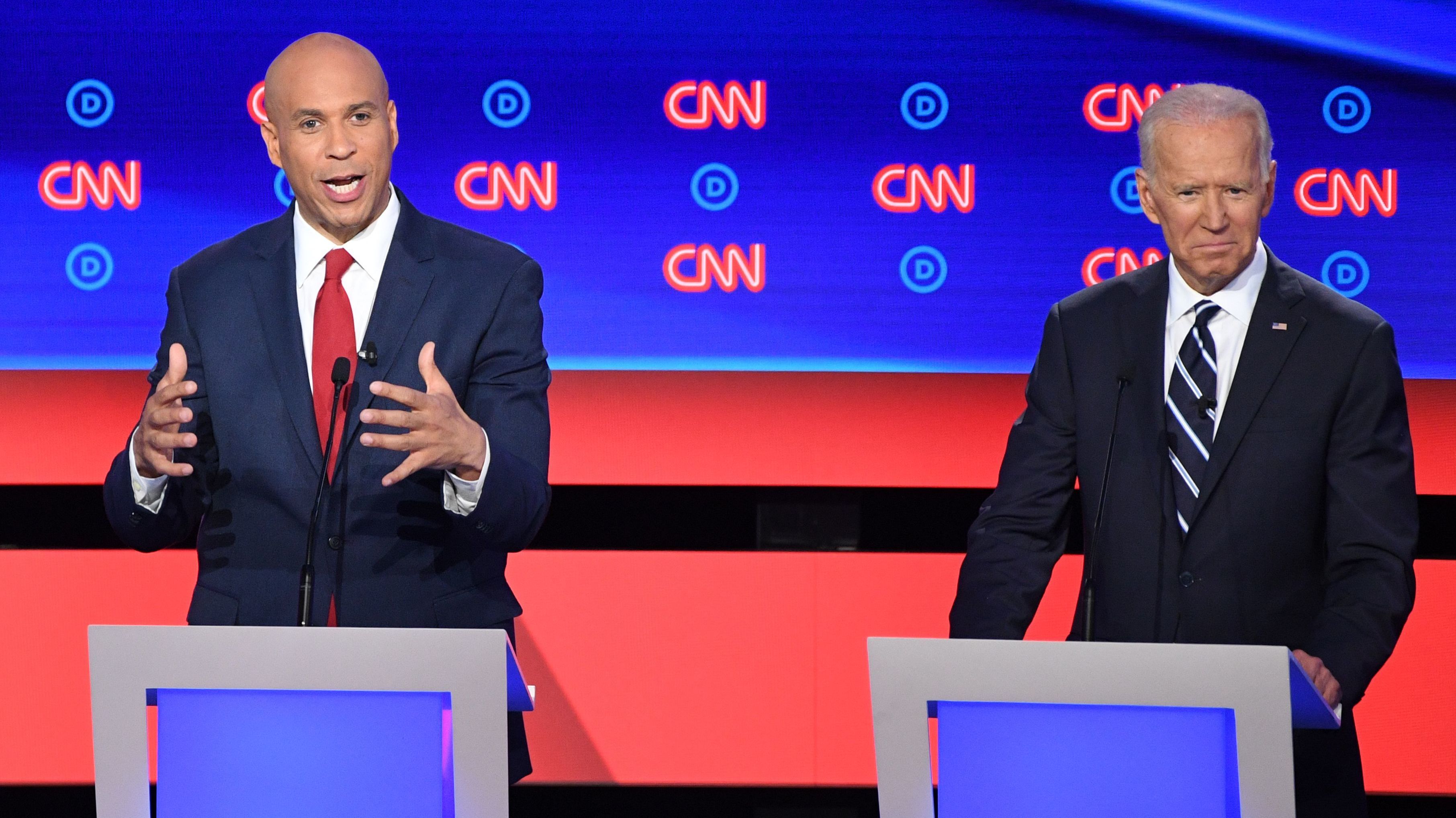 Democratic presidential hopeful New Jersey Sen. Cory Booker delivers his closing statement flanked by former Vice President Joe Biden during the Democratic debate in Detroit on Wednesday night. Booker pressed Biden on his record on crime.