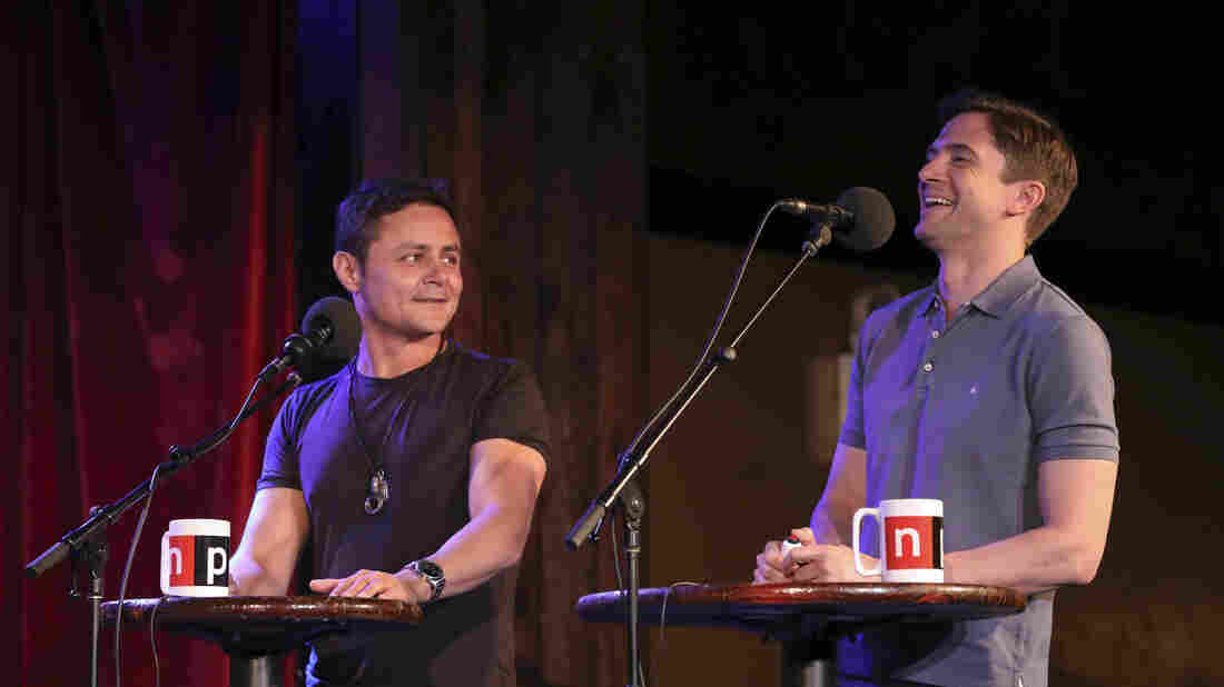Arturo Castro and Topher Grace face off in a game on Ask Me Another at the Bell House in Brooklyn, New York.