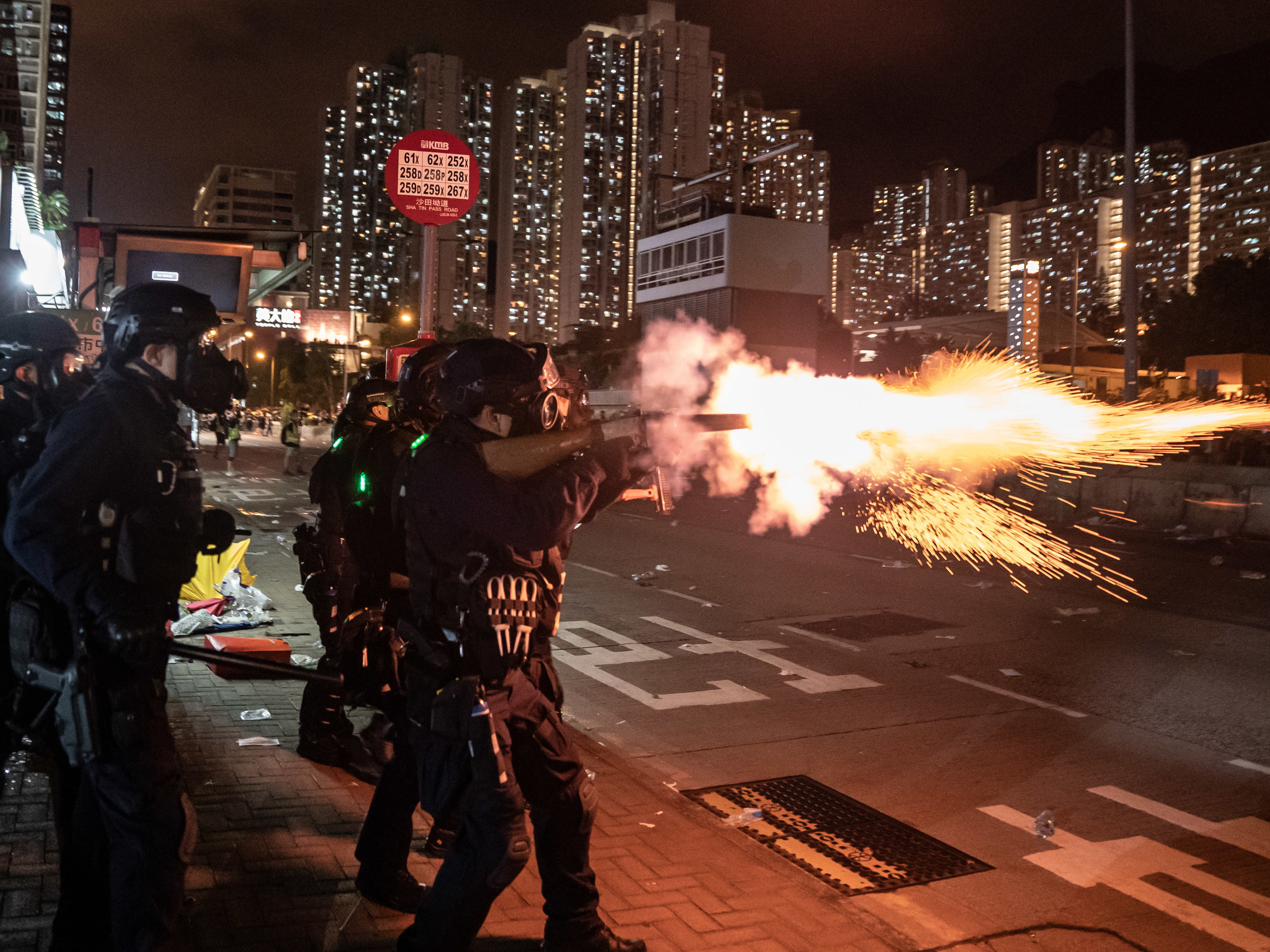 Riot police fire tear gas at protesters during a demonstration in Hong Kong's Wong Tai Sin District on Monday. (Getty Images)