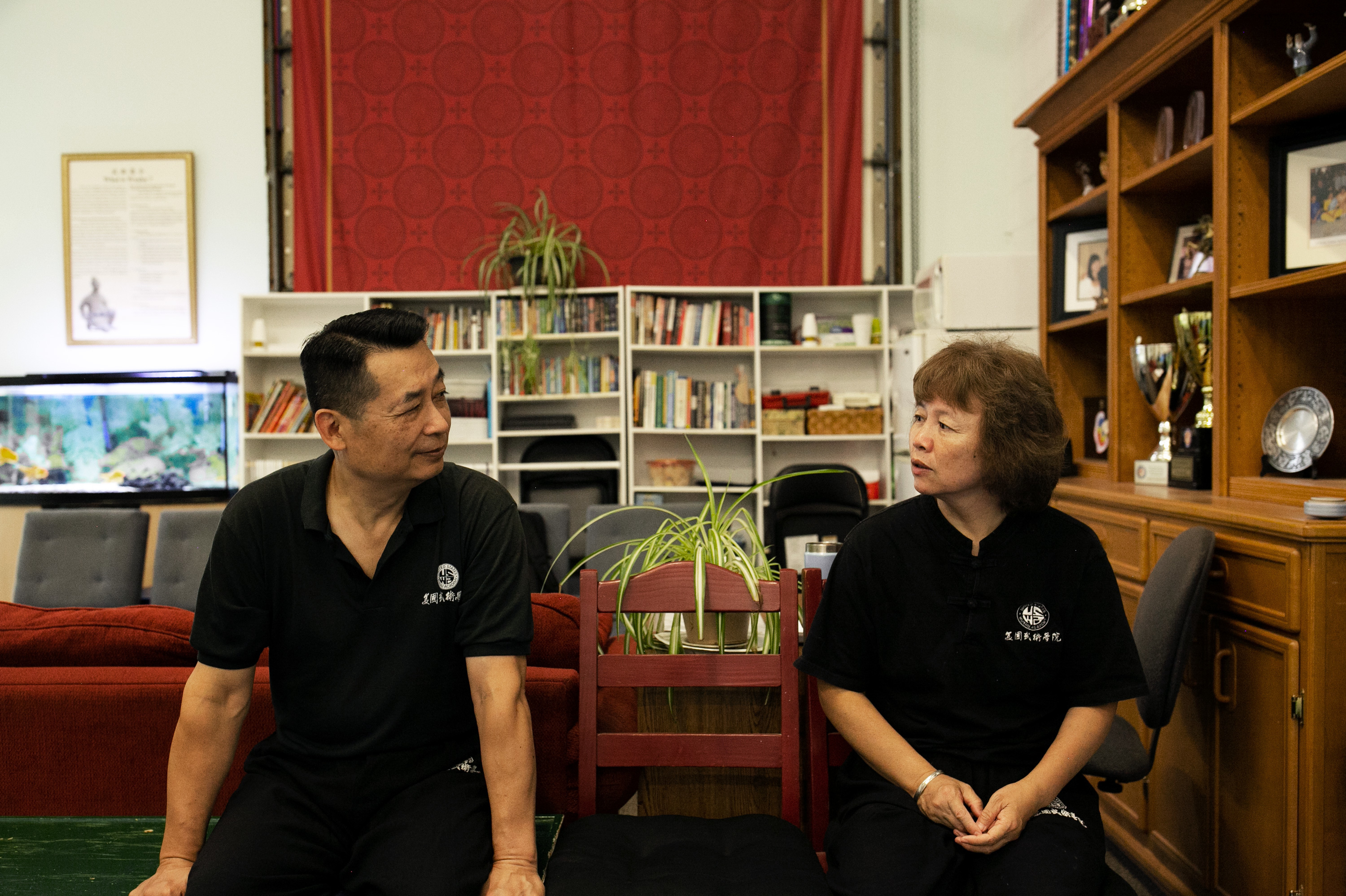Wushu Coaches Help Chinese Students Master Literacy And 'Become A Better Person' 2 Pei and Zhang chat during a class break. The couple met and married in the 1980s.