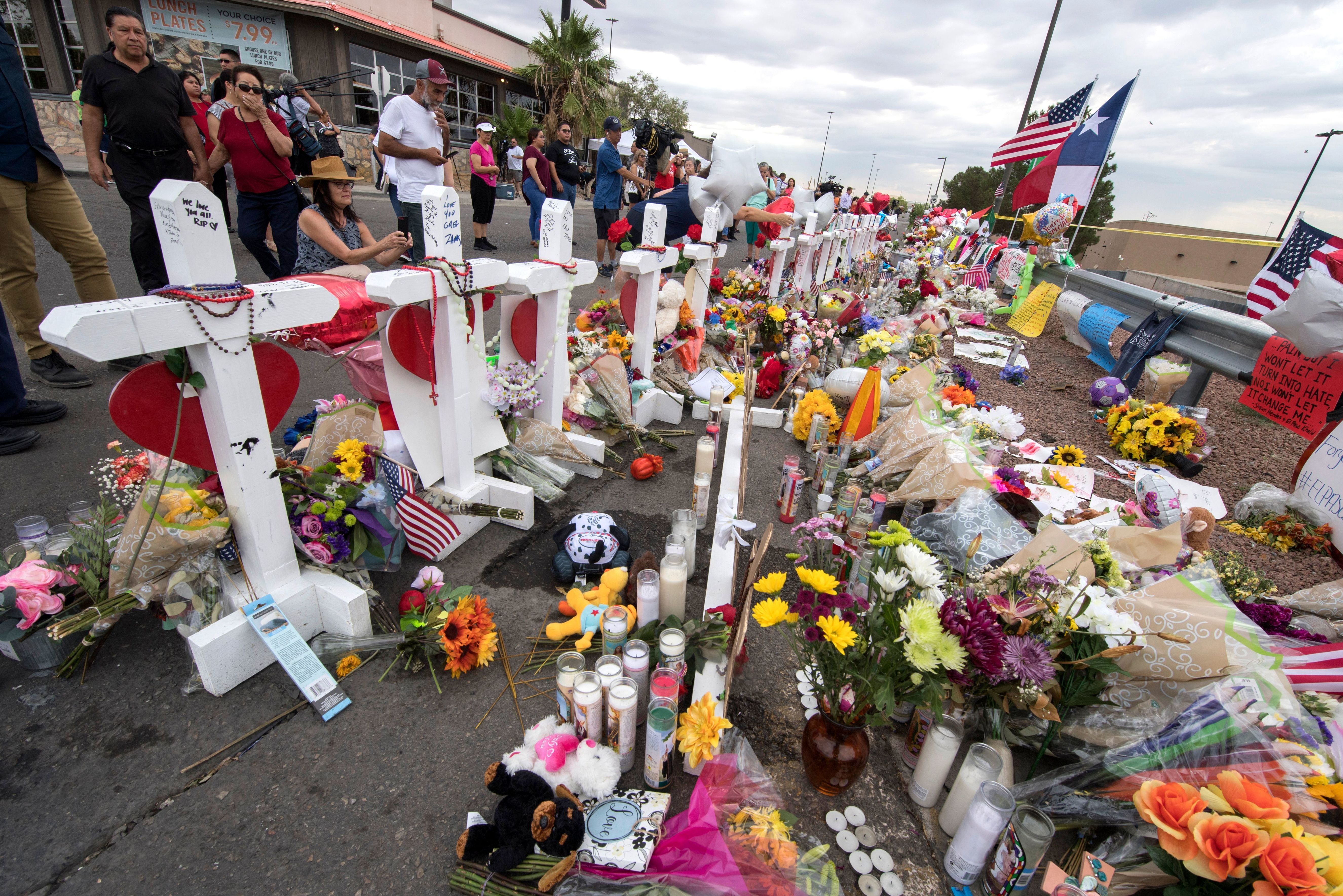 People leave flowers at a makeshift memorial for shooting victims at the Cielo Vista Mall Walmart, in El Paso, Texas. (AFP/Getty Images)
