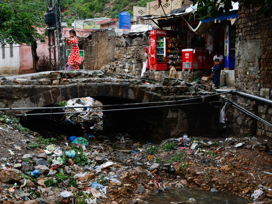 The river that once snaked through the village is now a large trash heap.