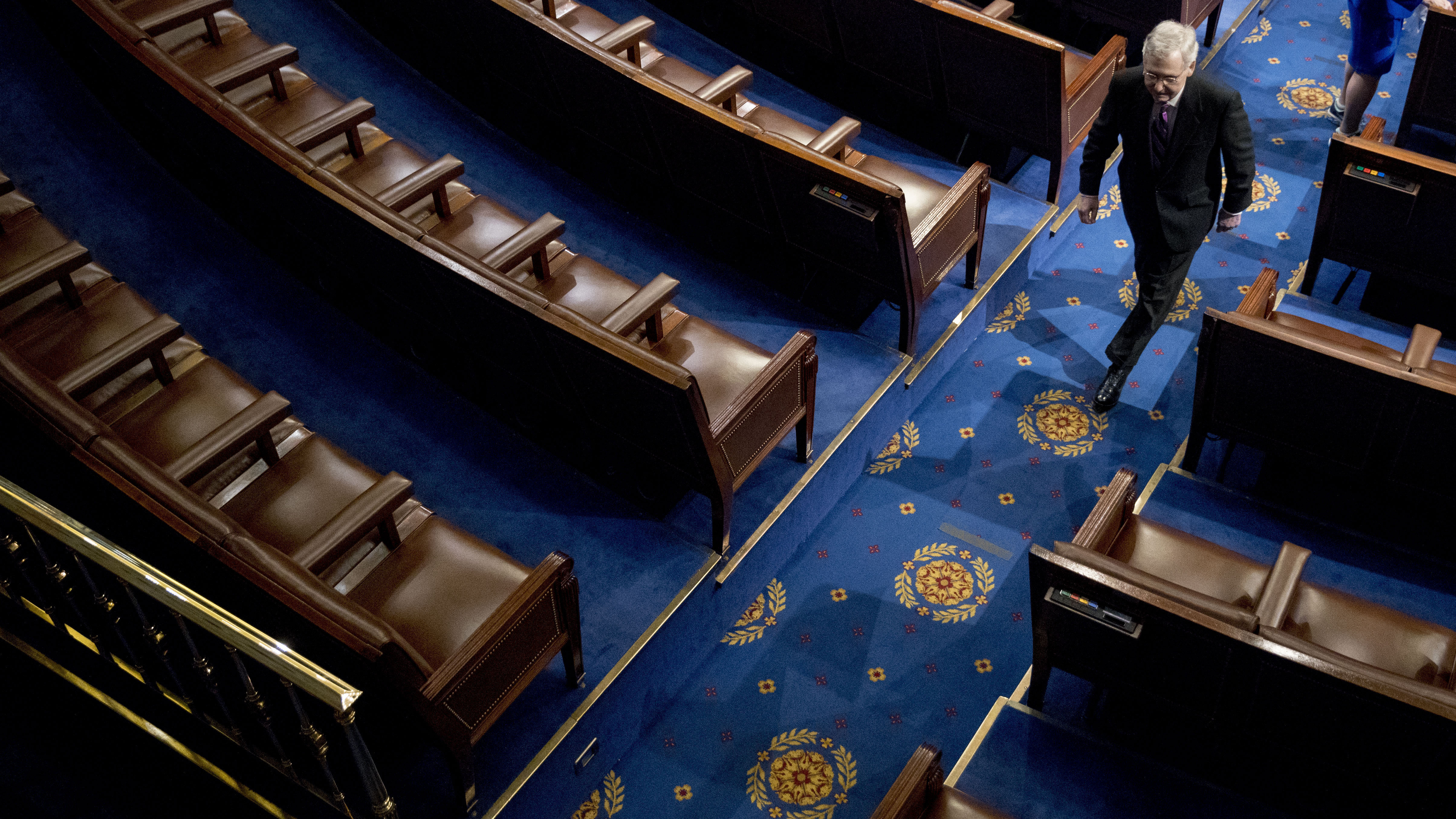 Senate Majority Leader Mitch McConnell of Kentucky walks off the House floor in April. In his chamber, McConnell can decide virtually by himself what the Senate will do — and even what it will consider doing.