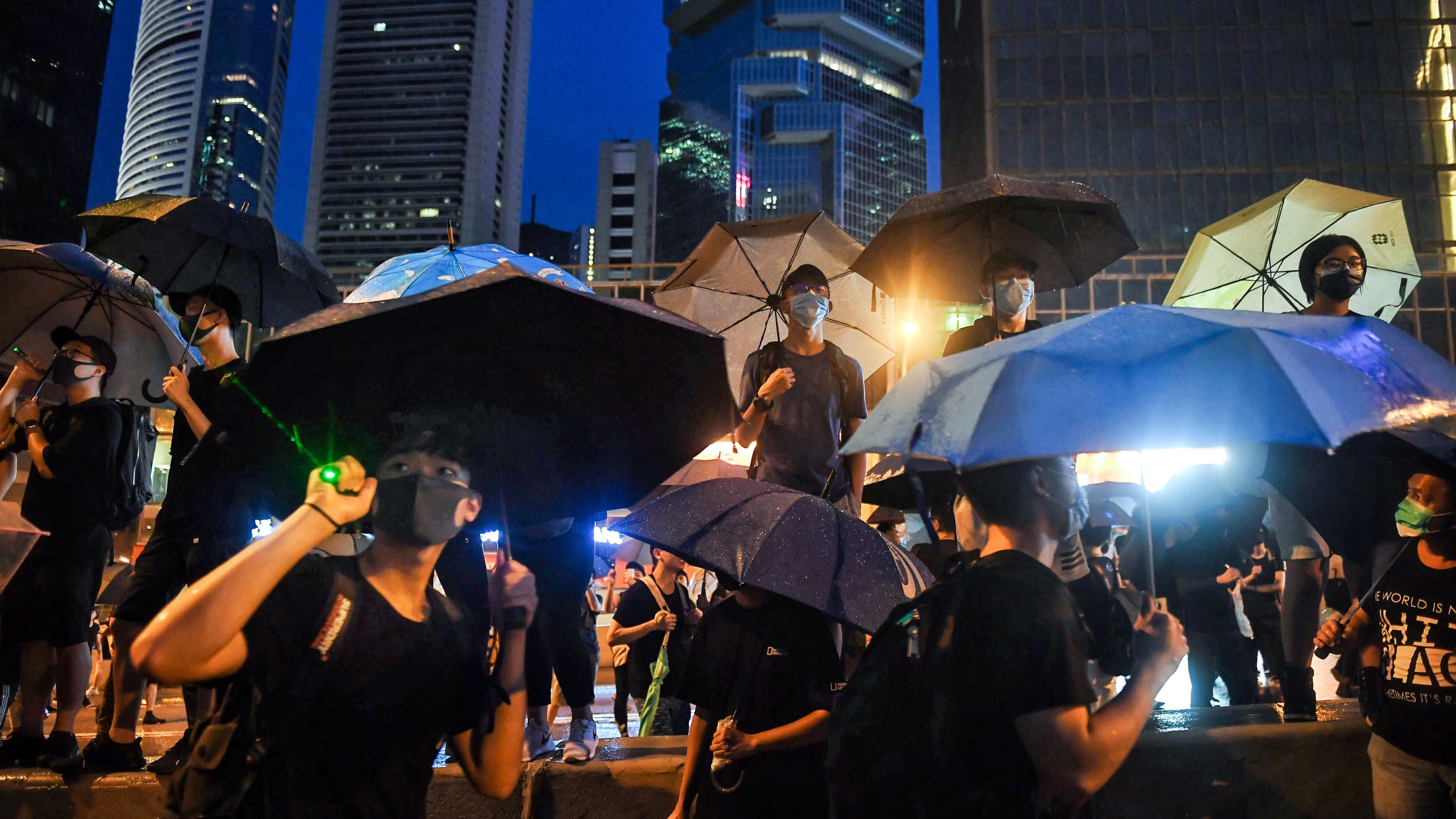 Protesters gather for a rally Sunday in Hong Kong. Many of the pro-democracy demonstrators have brandished umbrellas in a nod to a symbol widely used during the semiautonomous city's massive 2014 protests. (AFP/Getty Images)