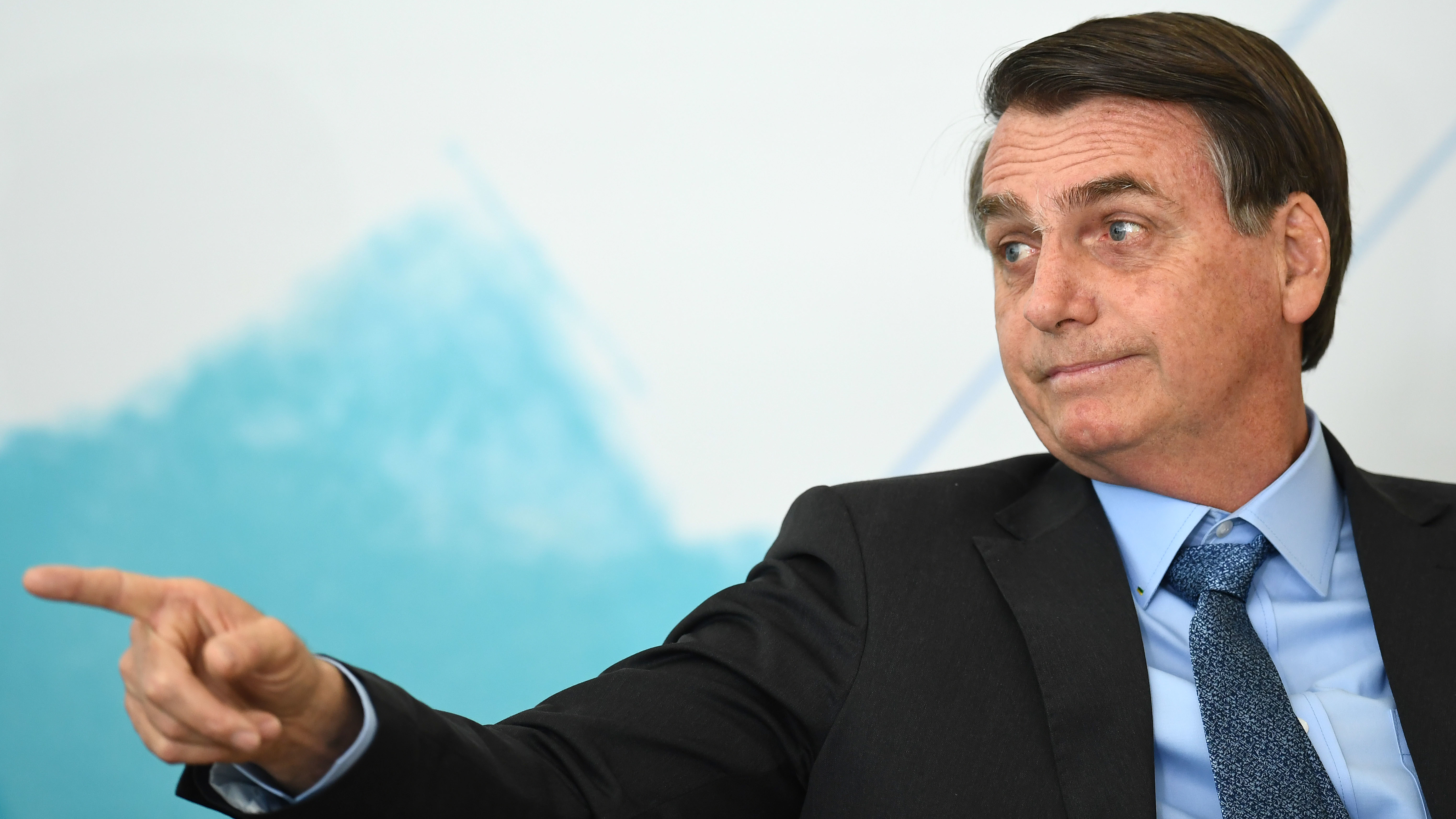 Brazilian President Jair Bolsonaro attends an International Youth Day celebration in Brasilia last week. Deforestation in the Amazon has soared since the far-right leader took office in January,