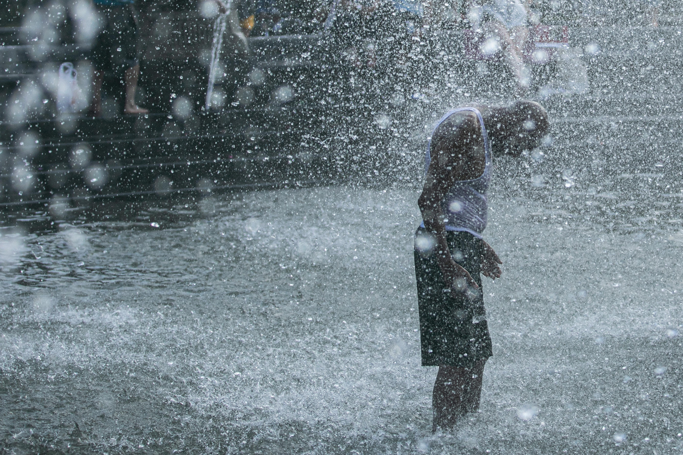 A man cools off in a fountain in New York's Washington Square Park this summer. Death from all causes doubled during a heat wave in New York City in August 1975, with heart attacks and strokes accounting for a majority of the excess deaths. (Bloomberg via Getty Images)