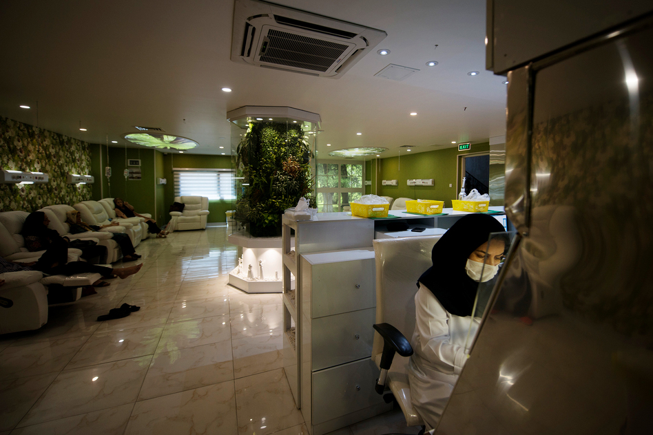Cancer patients receive chemotherapy treatment at Roshana Cancer Center, a private clinic in western Tehran. (Marjan Yazdi for NPR)