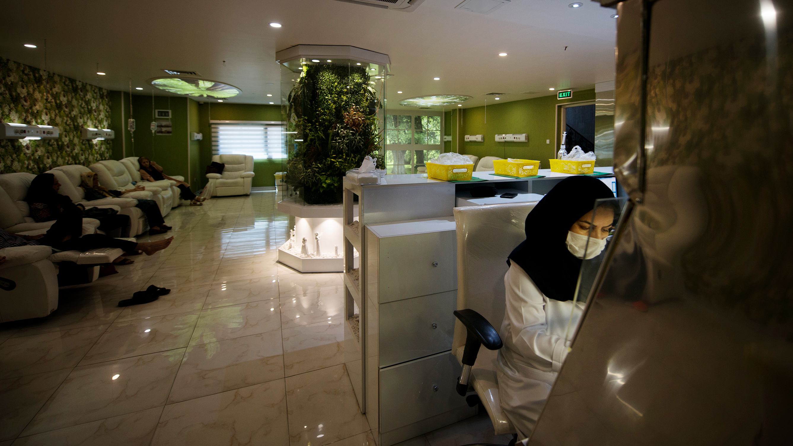 Cancer patients receive chemotherapy treatment at Roshana Cancer Center, a private clinic in western Tehran.