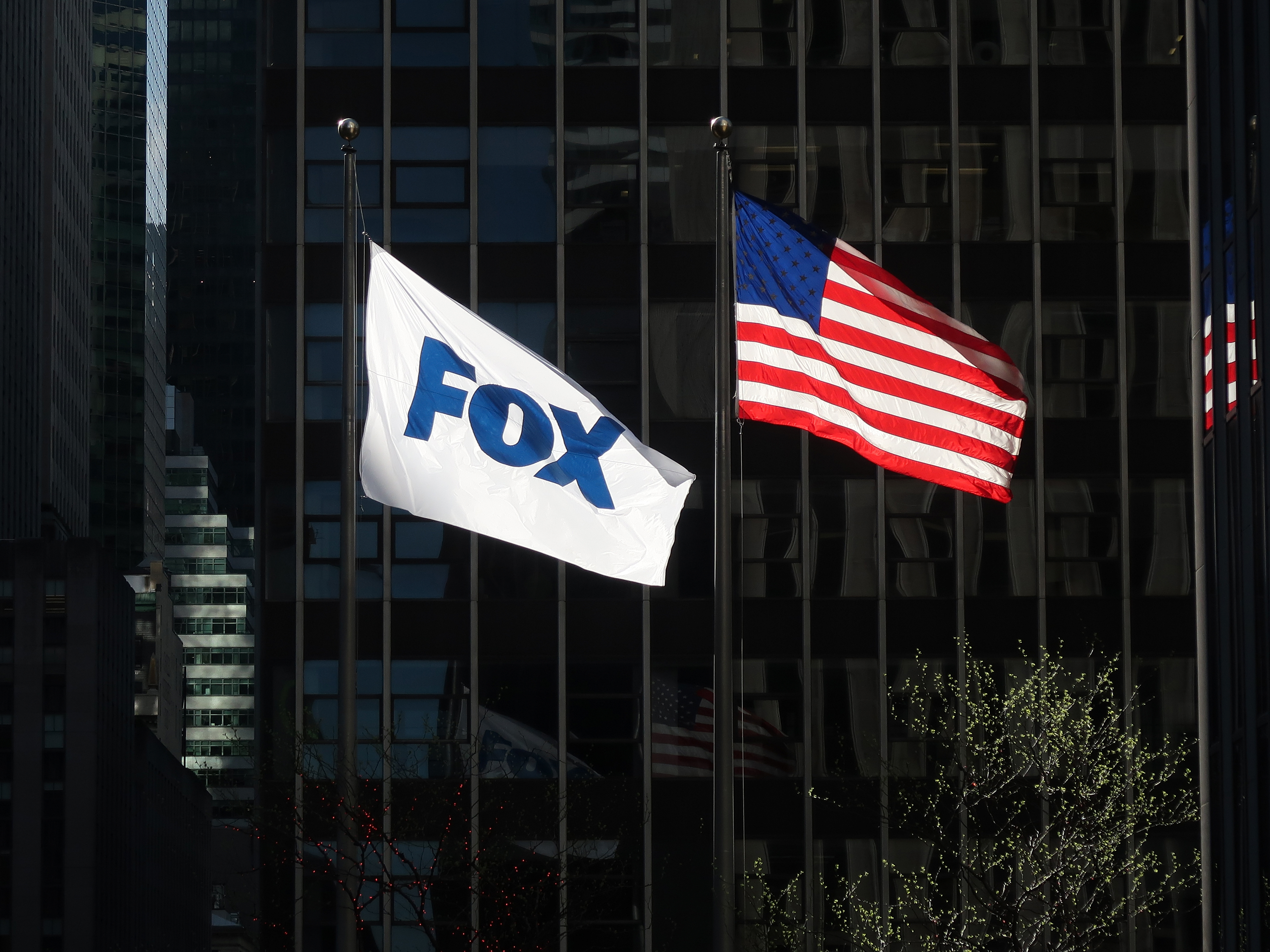 A flag with the new logo for FOX flies outside of the corporate headquarters on 6th Avenue on April 24, 2019 in New York City.