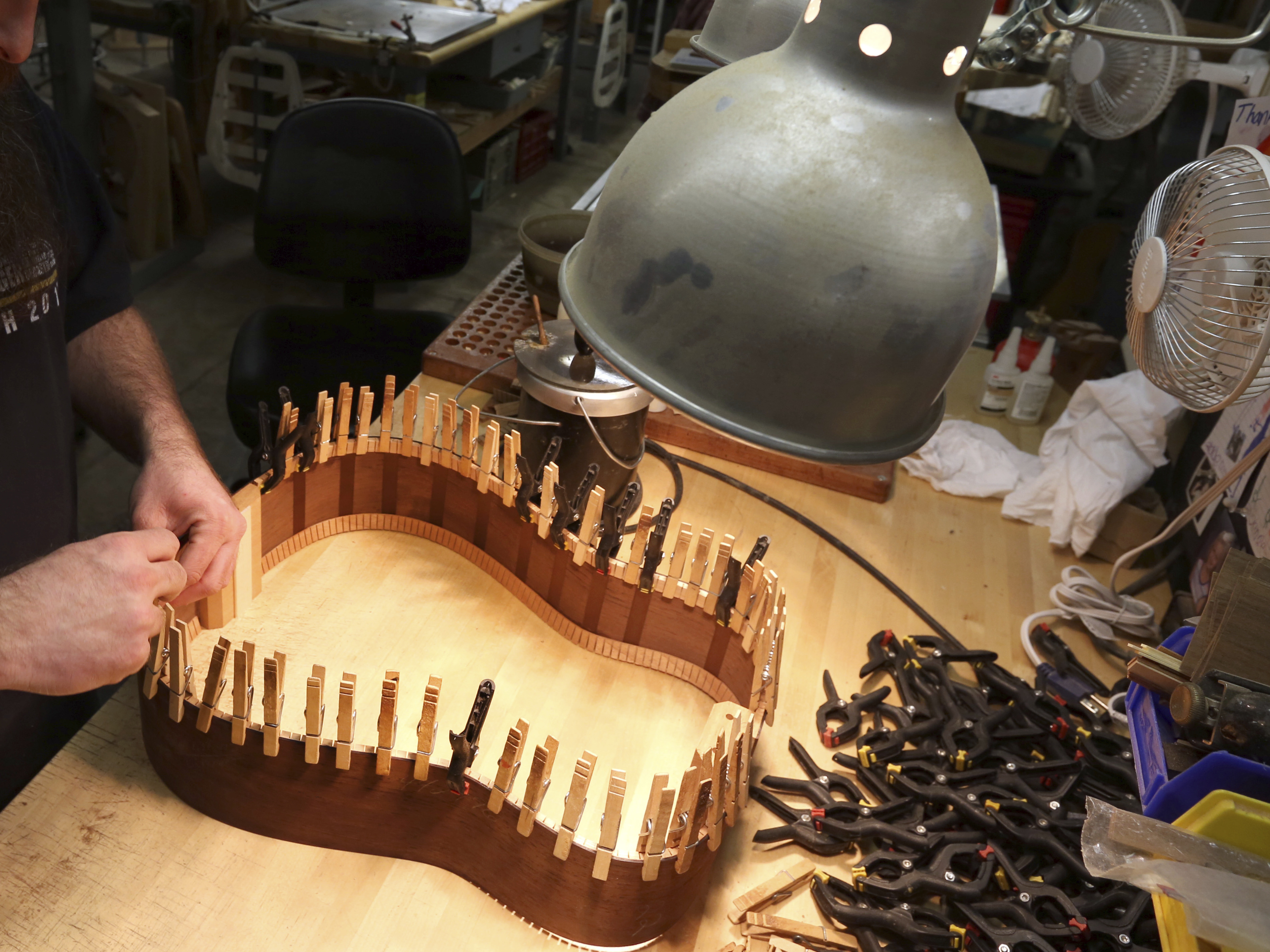 A luthier assembles the rosewood sides of a guitar at C.F. Martin & Co. in Nazareth, Pa. Instrument-makers and musicians will likely be able to transport instruments containing rosewood around the world without a burdensome permit process.