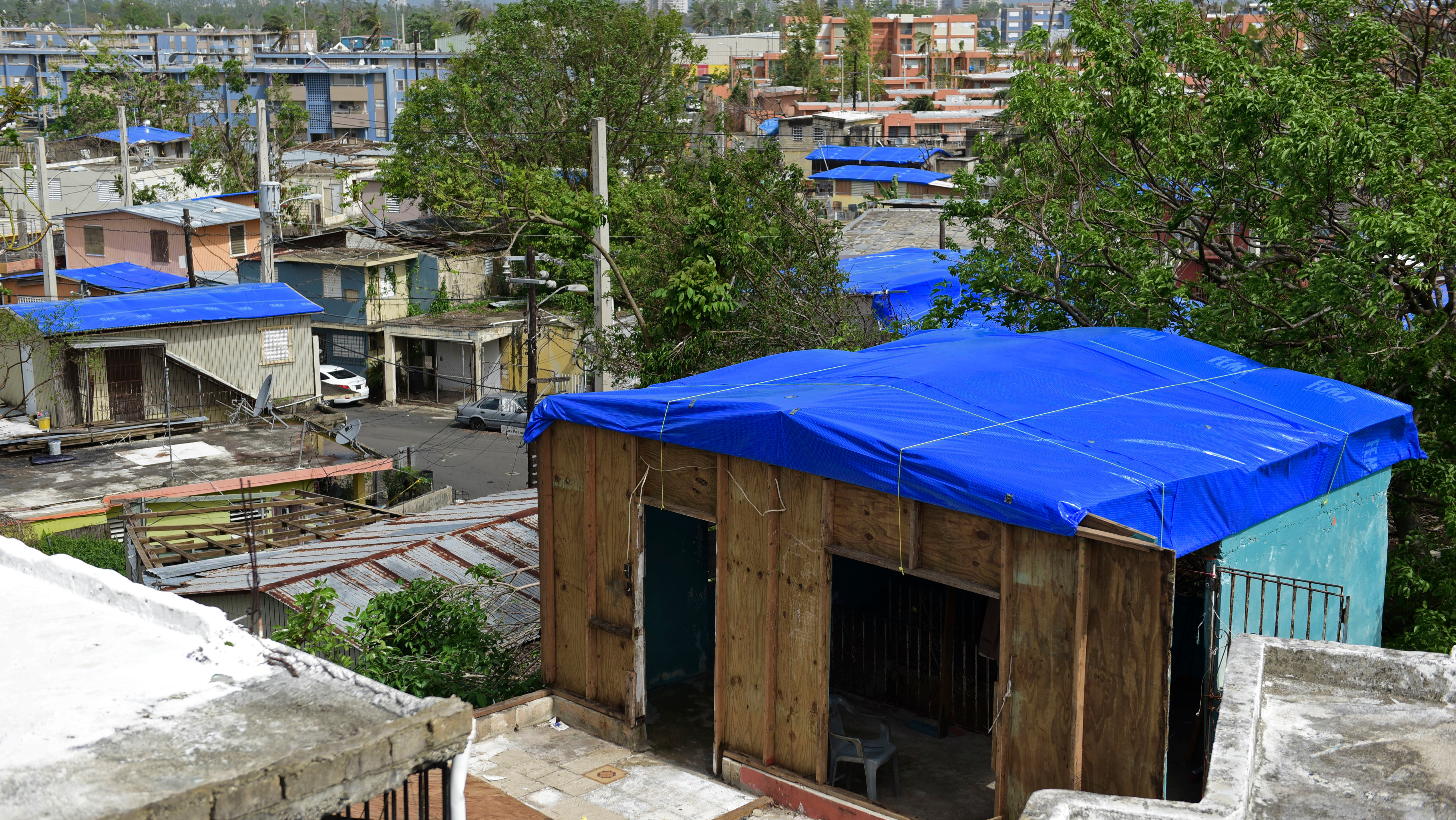 Homes in the Cantera area of San Juan, Puerto Rico are covered with FEMA tarps after Hurricane Maria. The island is now bracing for another major storm.