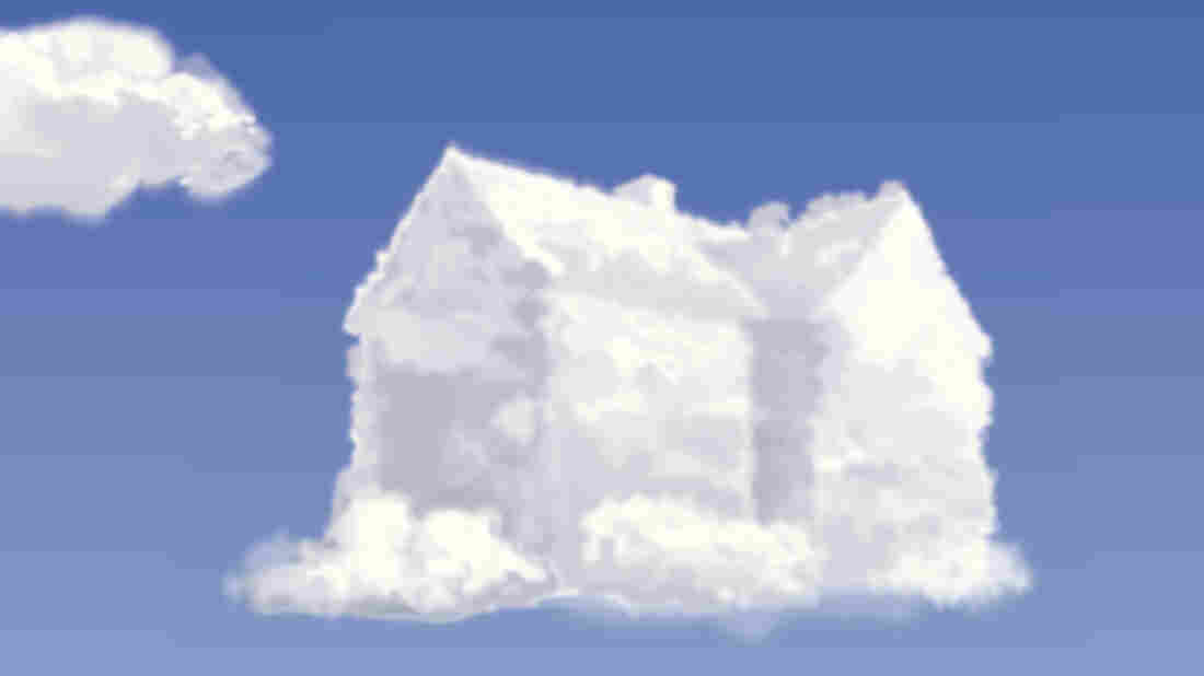 A cloud in the shape of a house floating against a clear blue sky.