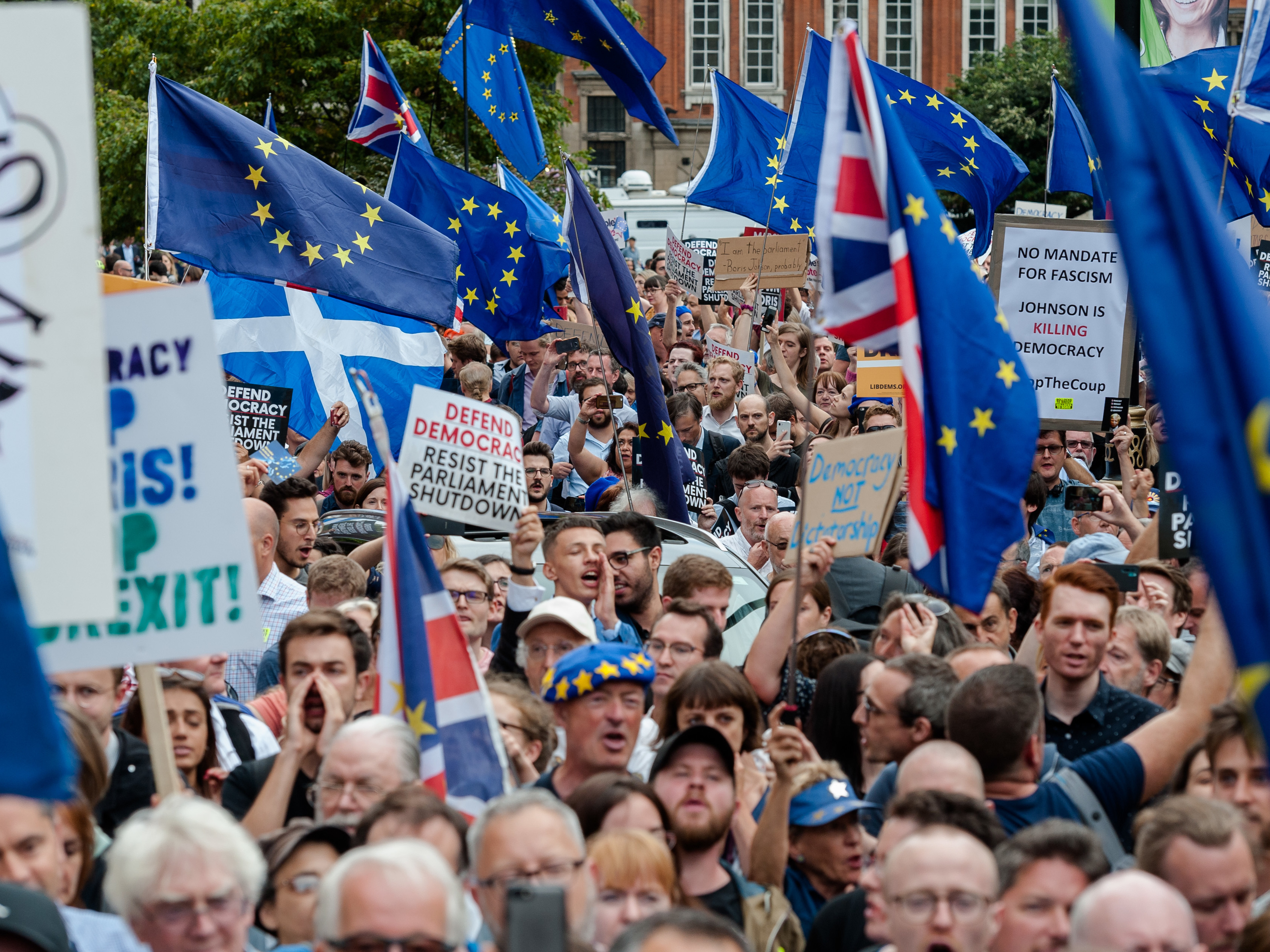 Thousands of demonstrators gather outside Houses of Parliament on Wednesday in London to protest against plans to suspend Parliament. (NurPhoto via Getty Images)