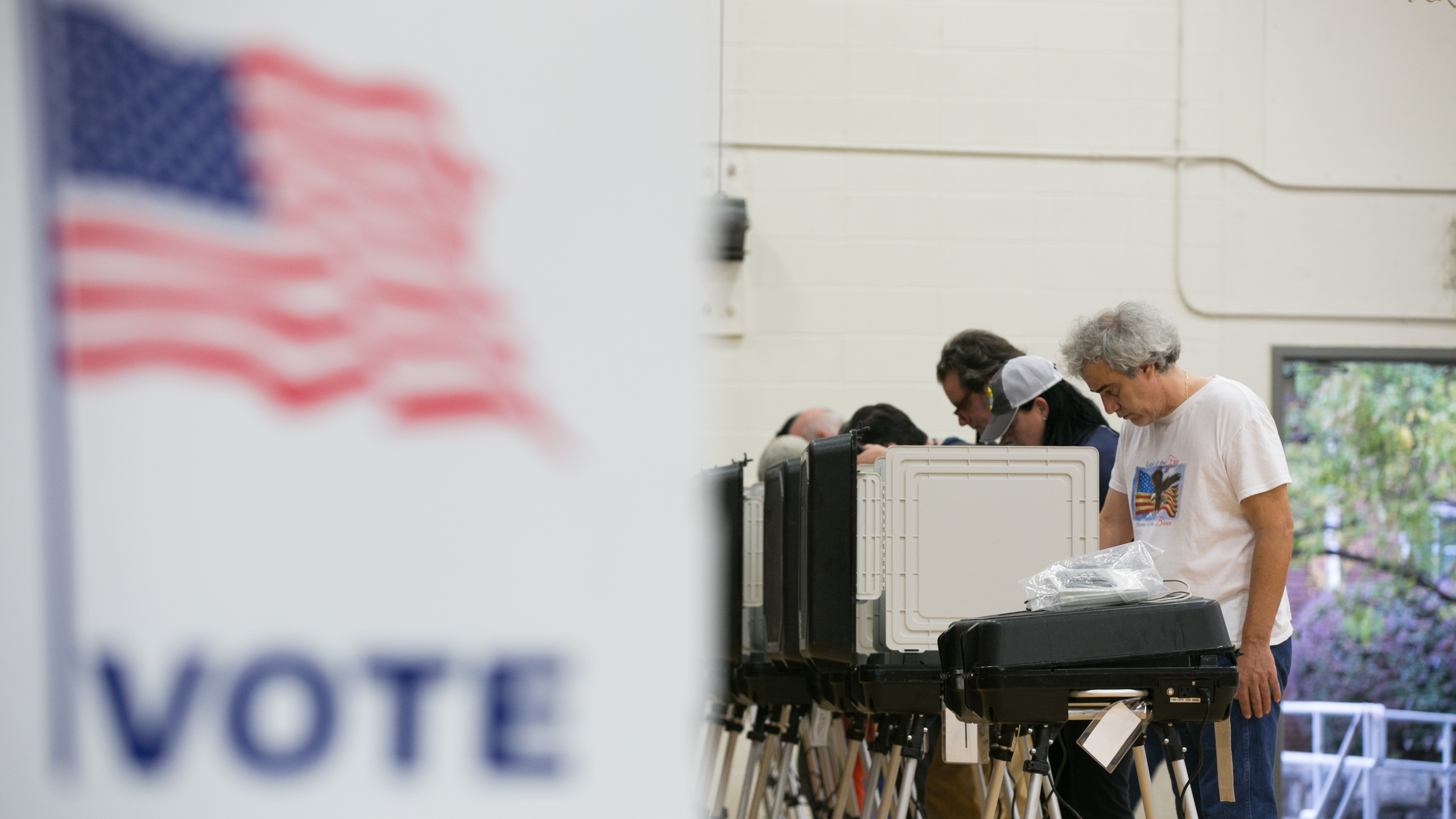 Voters cast their ballots at a polling station set up at Grady High School for the mid-term elections last November in Atlanta, Georgia. Georgia is set to replace all of its voting machines, which cybersecurity experts had deemed insecure, before the 2020 elections. (Getty Images)