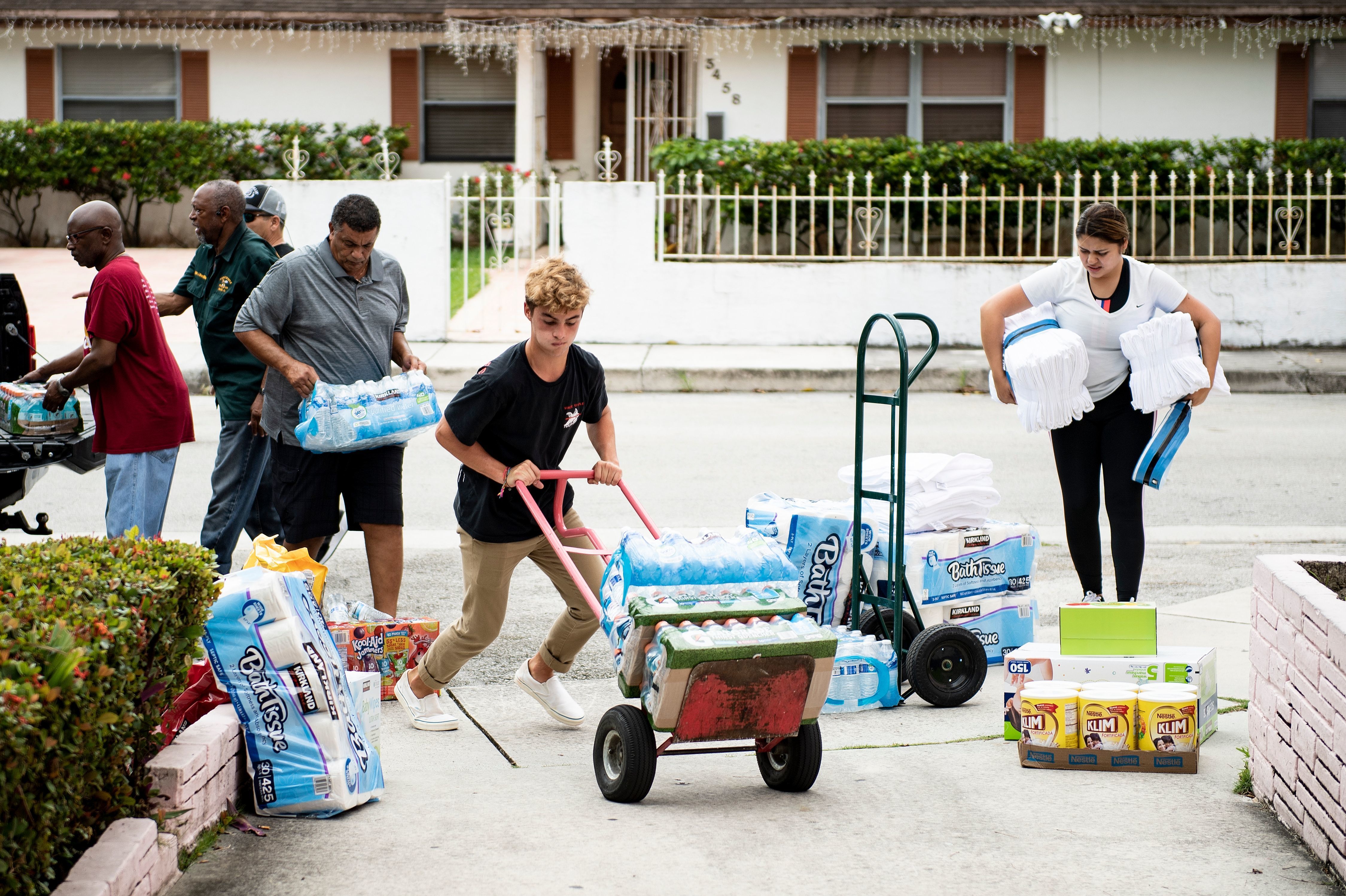 People gather donations for Hurricane Dorian relief at Christ Episcopal Church in Miami on Tuesday. Hurricane effects are likely to be felt in parts of Florida Tuesday evening. Georgia, North and South Carolina and Virginia could feel the effects of Dorian in the coming days.