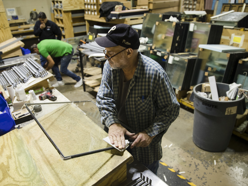 Gil Rodriguez constructs a door at the Howard McCray's commercial refrigeration manufacturing facility in Philadelphia last October. Manufacturing activity in the U.S. shrank last month for the first time in three years. (Matt Rourke/AP)