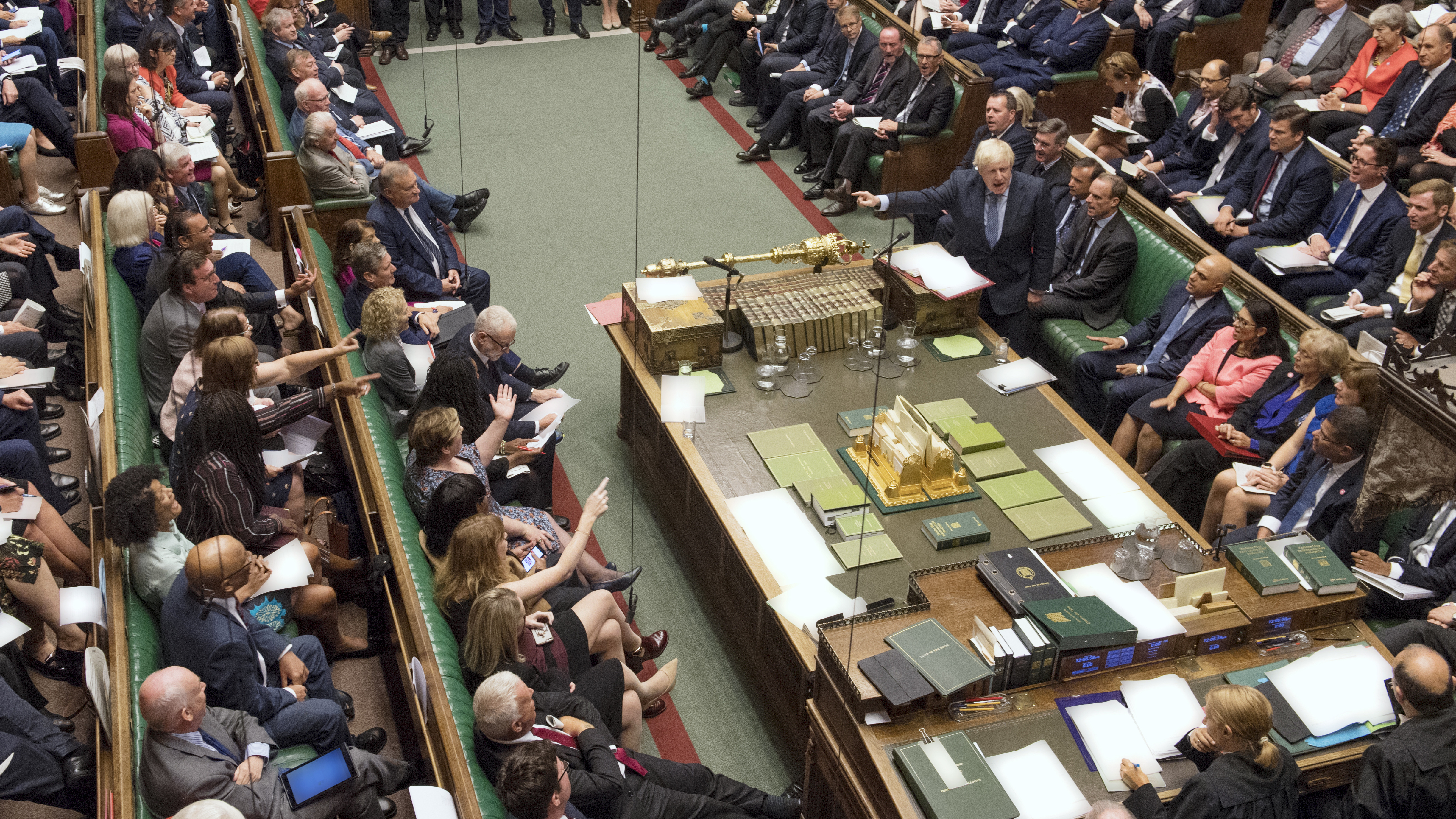 The U.K.'s House of Commons has voted to block a no-deal Brexit, prompting Prime Minister Boris Johnson to call for a general election next month. In this photo provided by the House of Commons, Britain's Prime Minister Boris Johnson, center right, gestures during his first Prime Minister's Questions in London Wednesday.