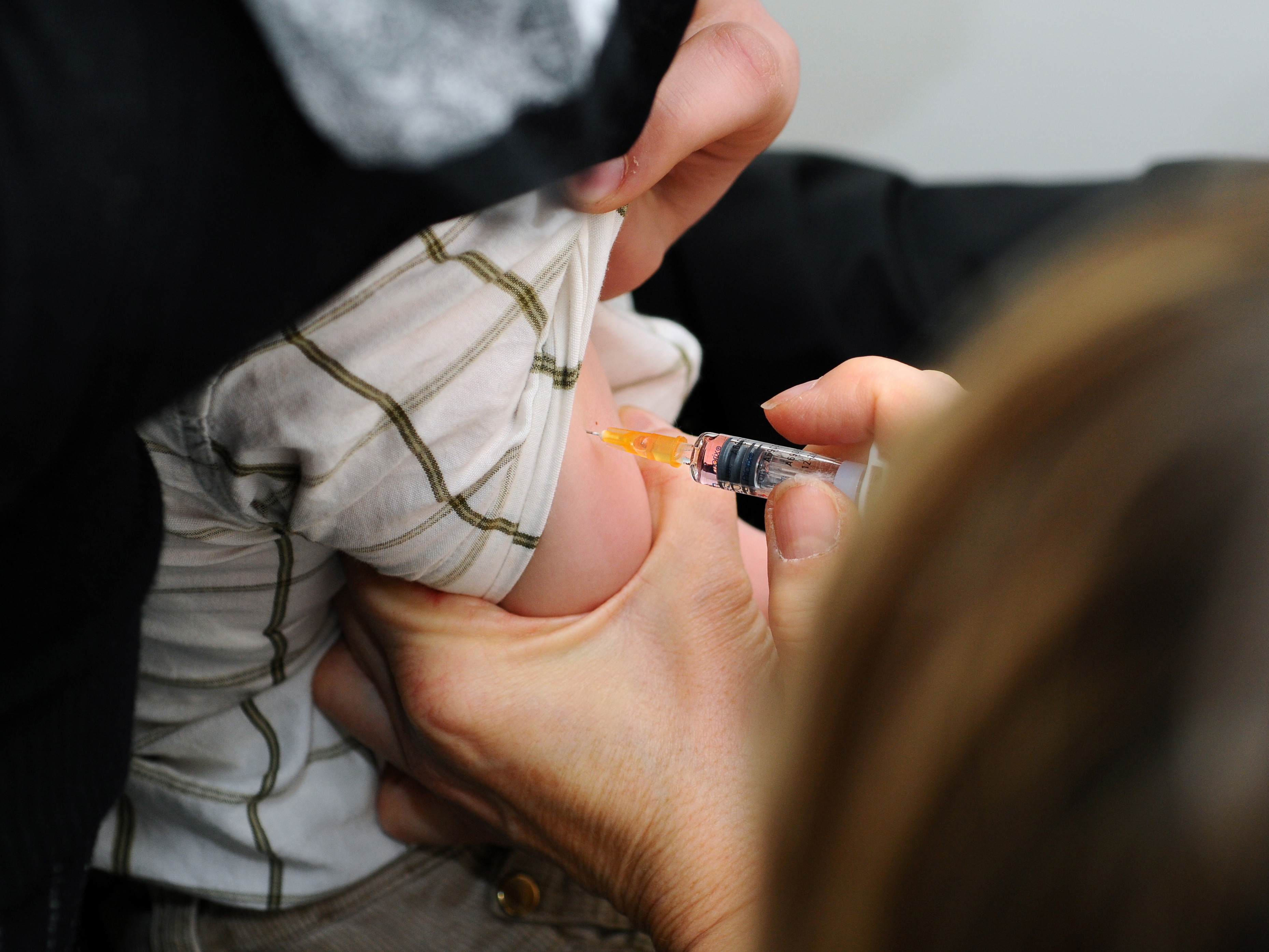 A child is immunized against measles, mumps and rubella in Lyon, France. (Universal Images Group via Getty)
