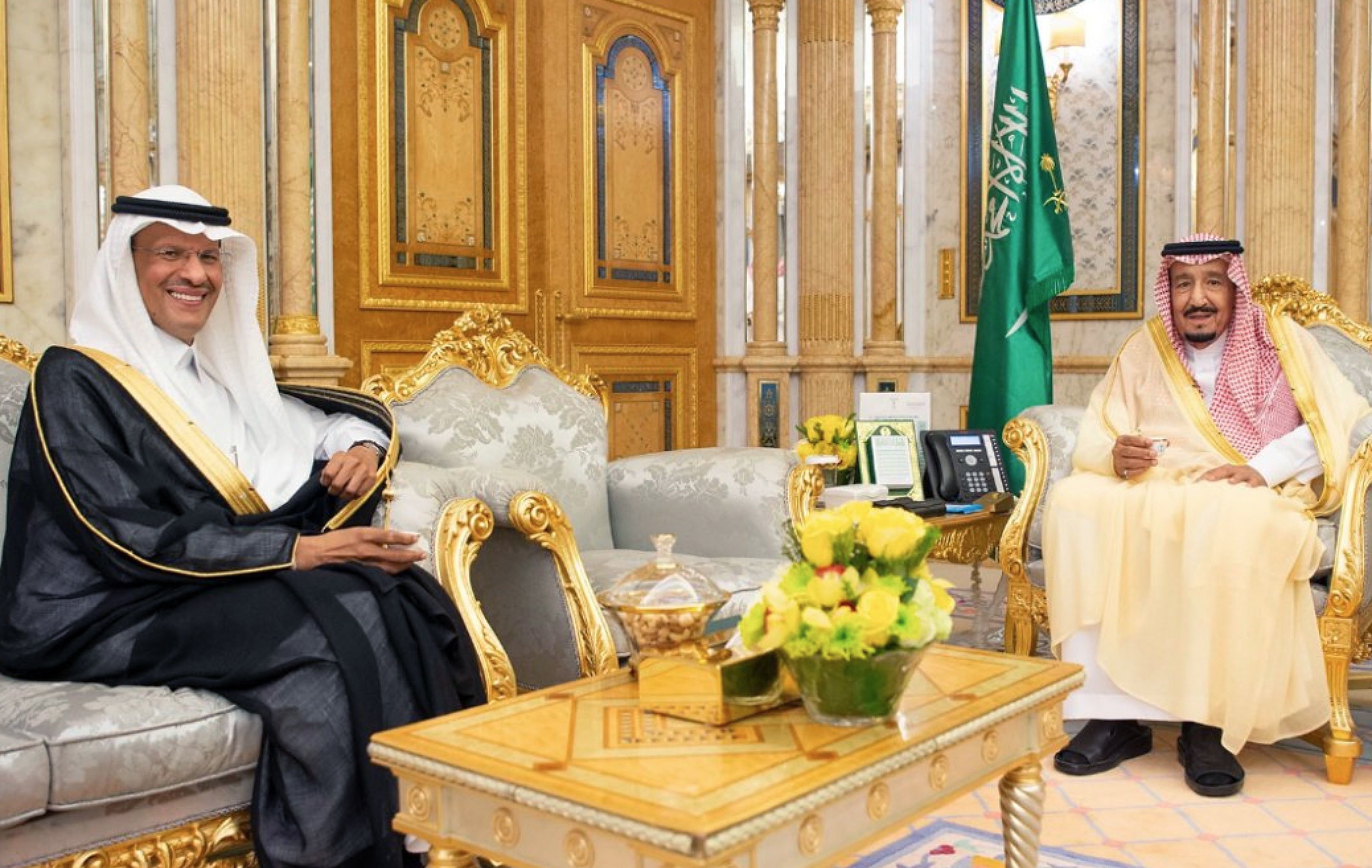 The newly appointed Saudi energy minister, Prince Abdulaziz bin Salman (left), meets with his father King Salman, in a handout picture provided by the Saudi Press Agency on Monday. (Saudi Press Agency via AFP/Getty Images)