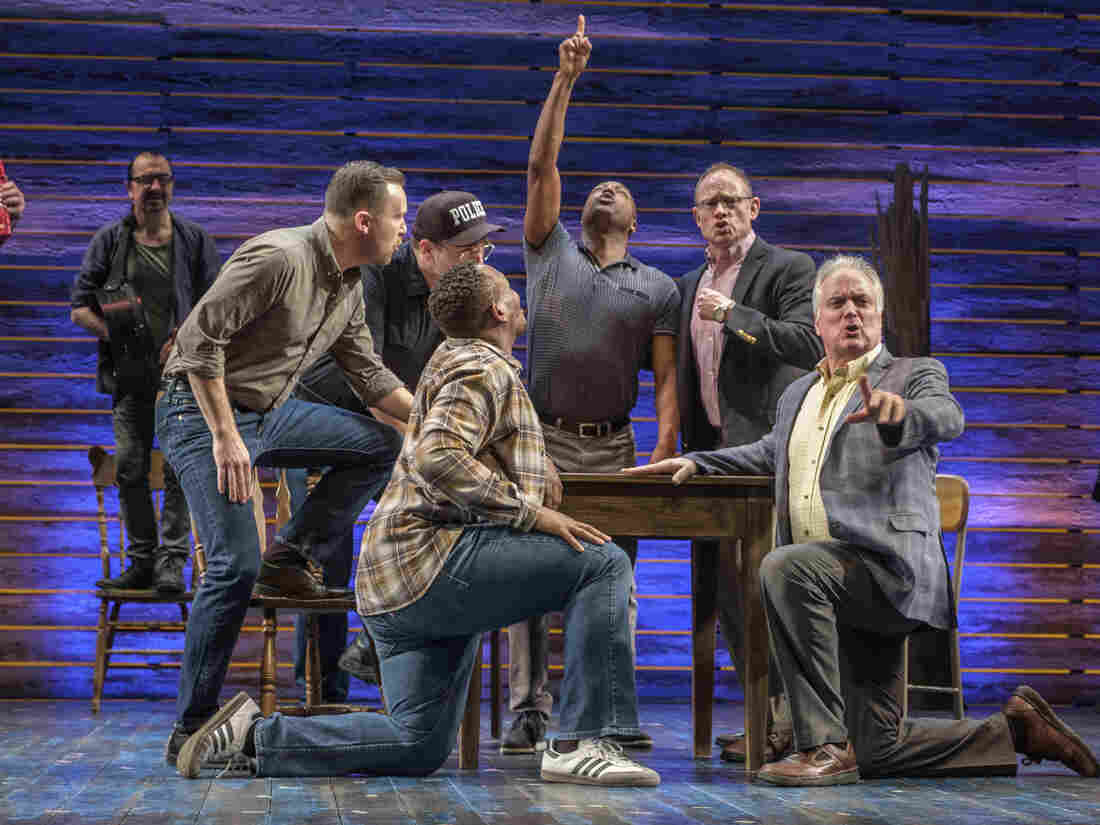 The cast of "Come from Away" perform at the Phoenix Theatre in London.