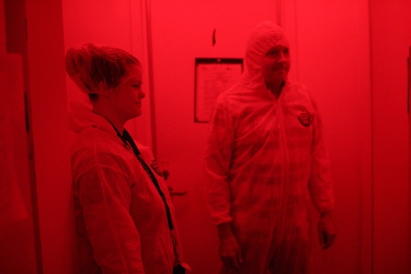 Amanda Stout and Kim Hoelmer, in the quarantine room at the USDA Beneficial Insects Introduction Research Unit in Newark, Del. The room uses red light because insects cannot sense it.