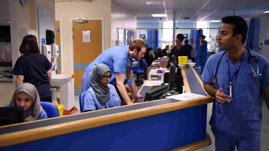 Members of clinical staff work at computers in the Accident and Emergency department of the 'Royal Albert Edward Infirmary' on April 2, 2015. (Photo credit should read OLI SCARFF/AFP/Getty Images)