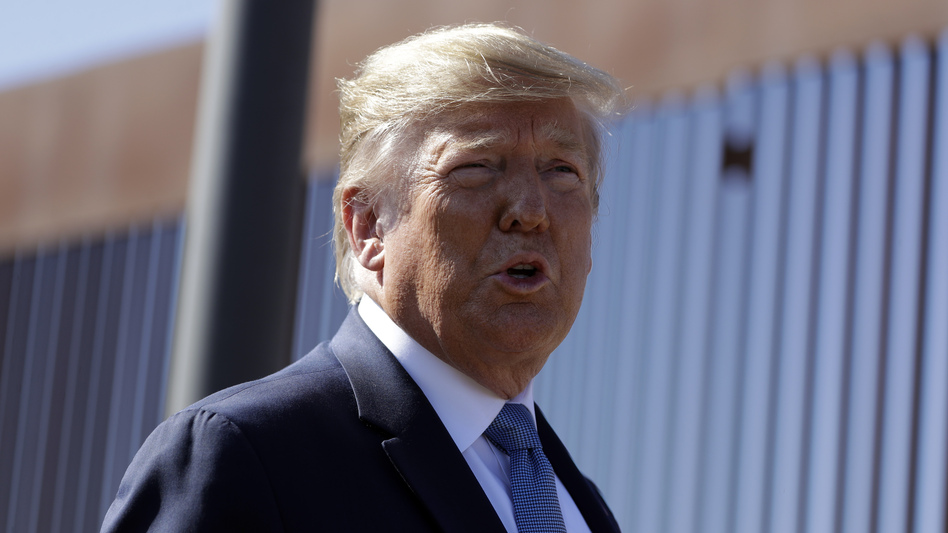 President Trump denies he said anything inappropriate in a conversation with a foreign leader, as a whistleblower alleges. (Evan Vucci/AP)
