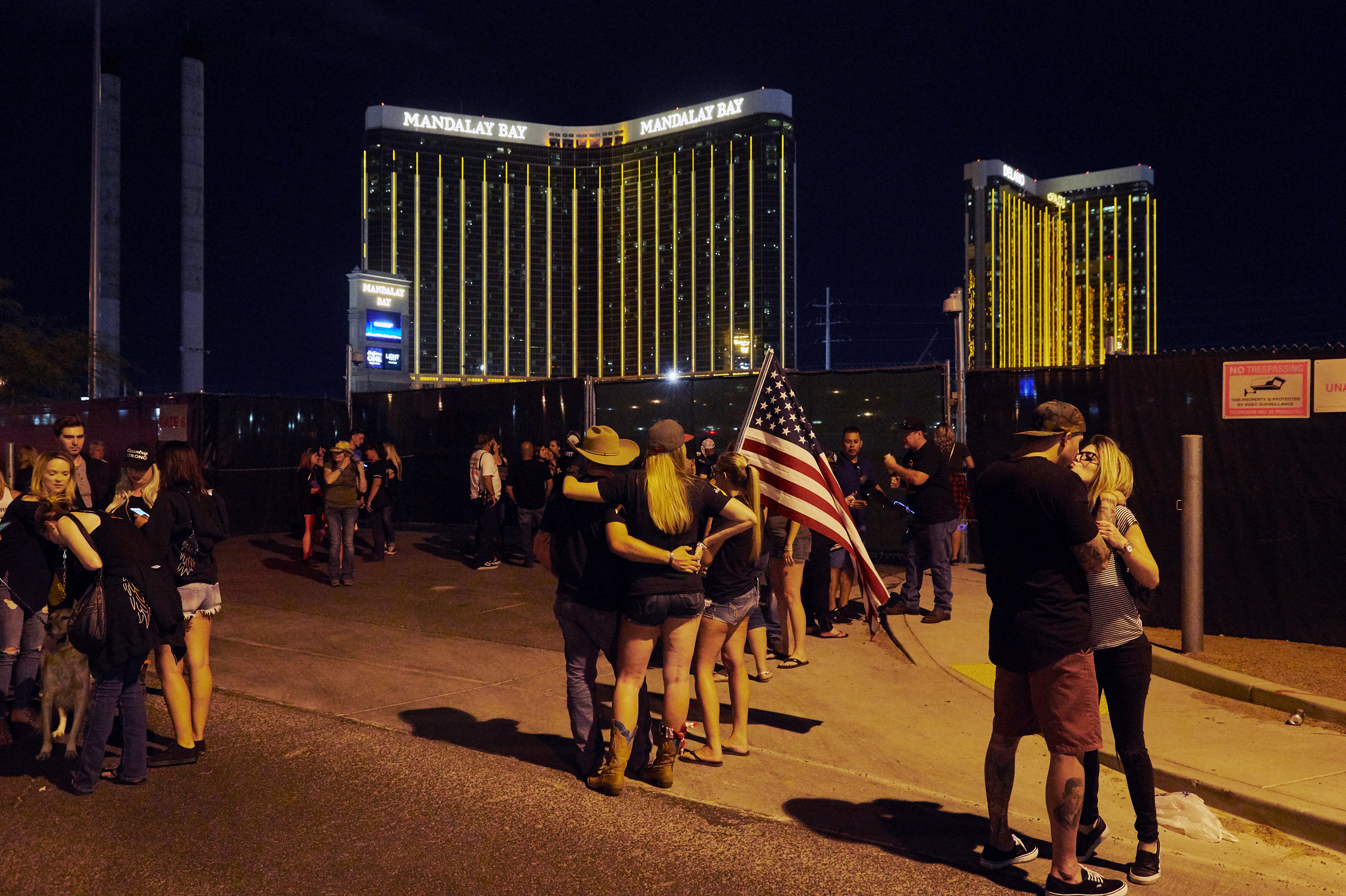 Survivors gather near the Route 91 Harvest festival grounds on Oct. 1, 2018, the first anniversary of the Las Vegas shooting. More than 20,000 people were at the country music festival a year earlier when a gunman opened fire from the Mandalay Bay Resort and Casino. (Bridget Bennett)