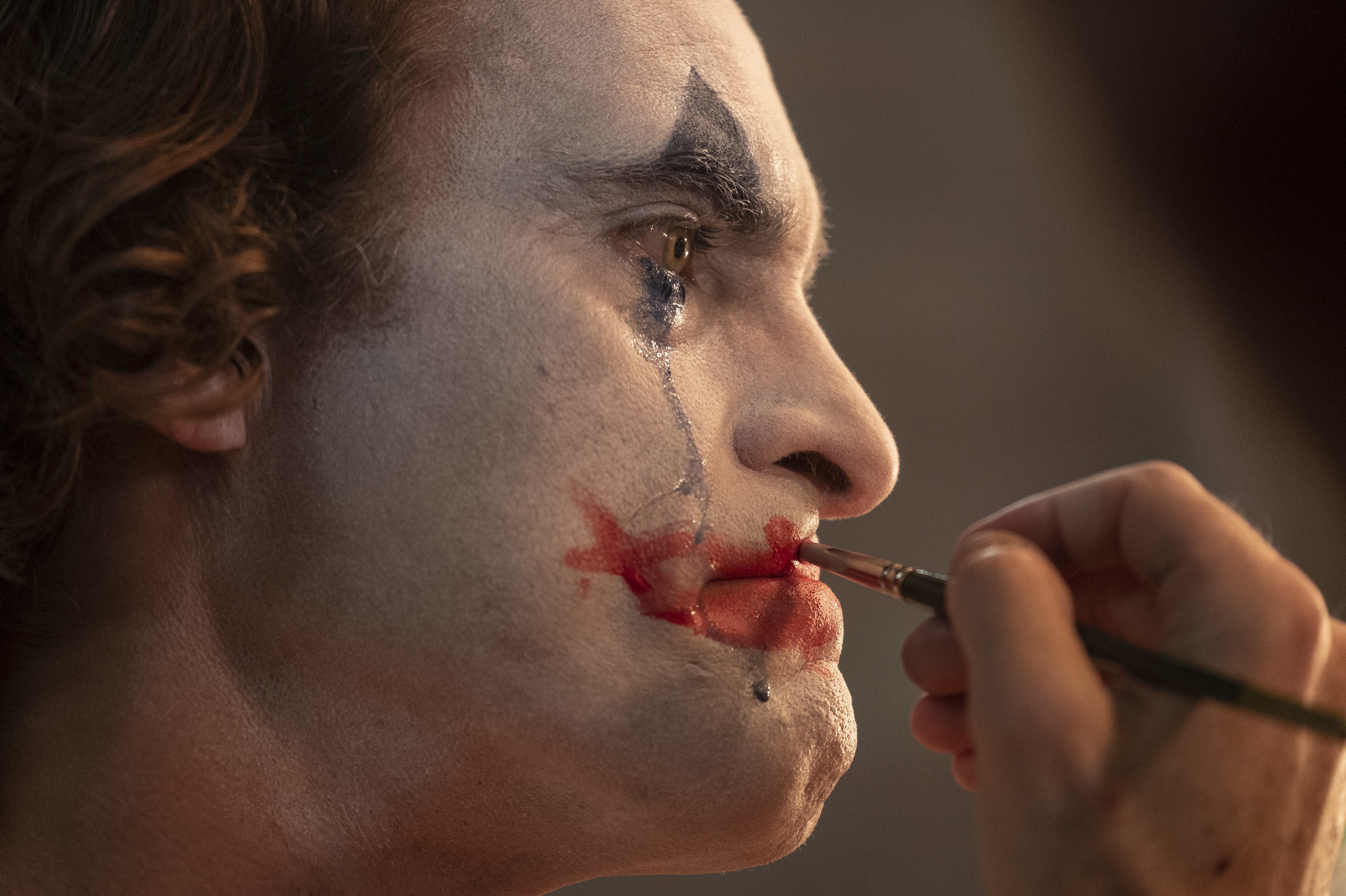 Why so serious?: In <em>Joker</em>, failing stand-up comedian Arthur Fleck, played by Joaquin Phoenix, is done being the butt of the joke. (Warner Bros. Entertainment Inc.)