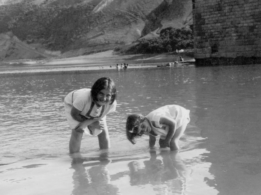 Renia Spiegel (left) and her younger sister, now known as Elizabeth Bellak, wade in the Dniester River around 1935. The photo can be seen on the cover of the published edition of <em>Renia's Diary.</em> (St. Martin's Press)